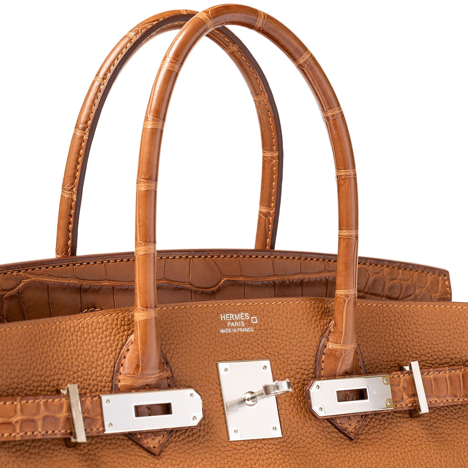 Close-up of the top handles and gold palladium hardware on a Hermès Birkin 30 in togo leather
