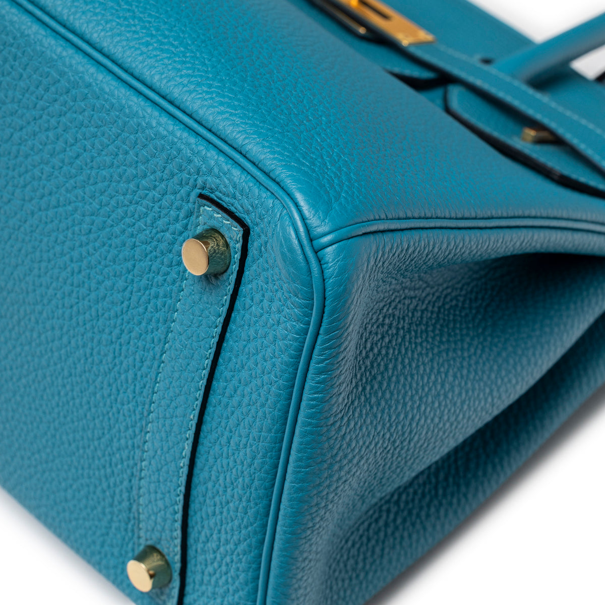 Close-up of bottom corner and gold feet on Hermès Birkin 30 Turquoise Togo Gold Hardware handbag