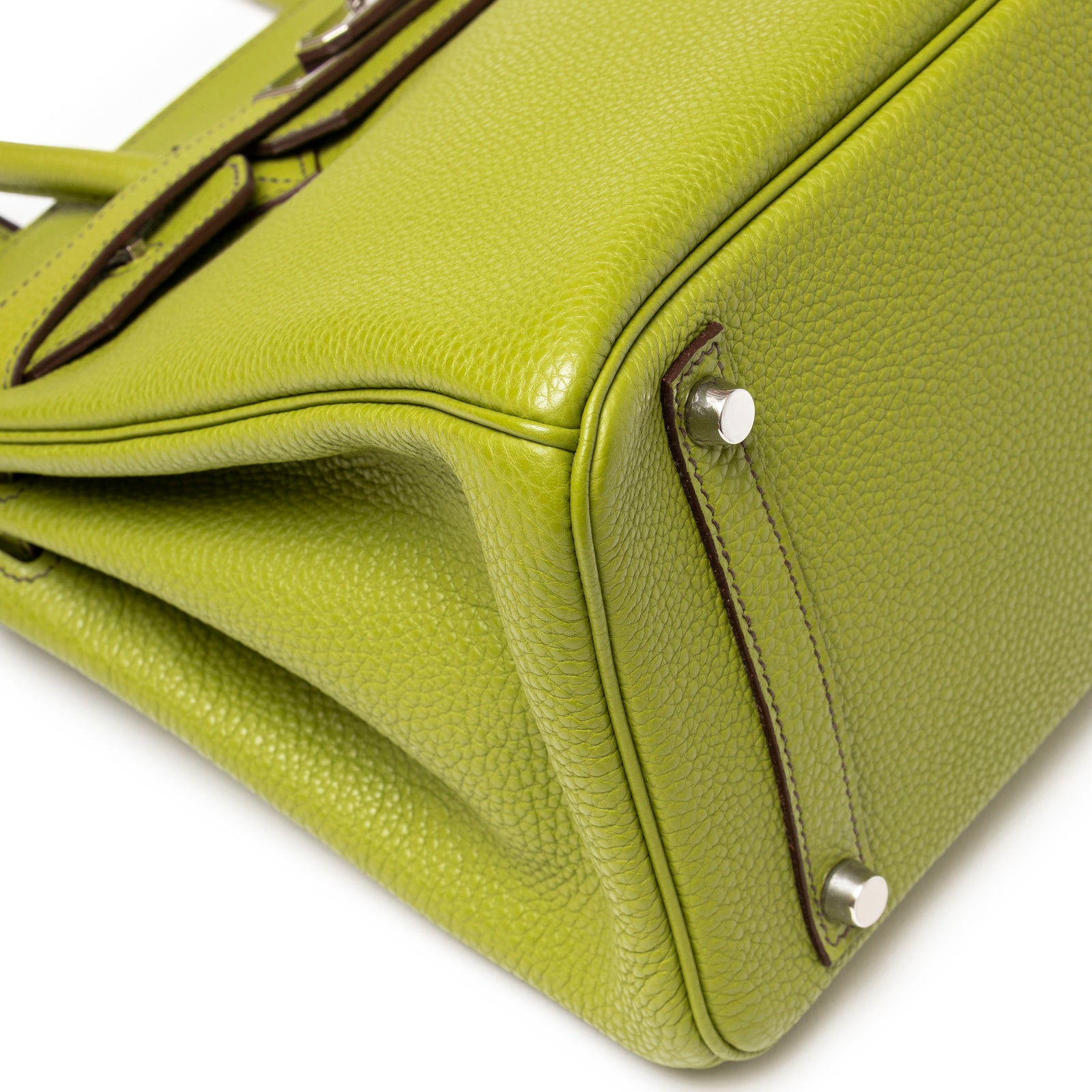 Close-up of bottom corner on Hermès Birkin 30 Vert Anis Togo Palladium Hardware showing textured leather and studs detail
