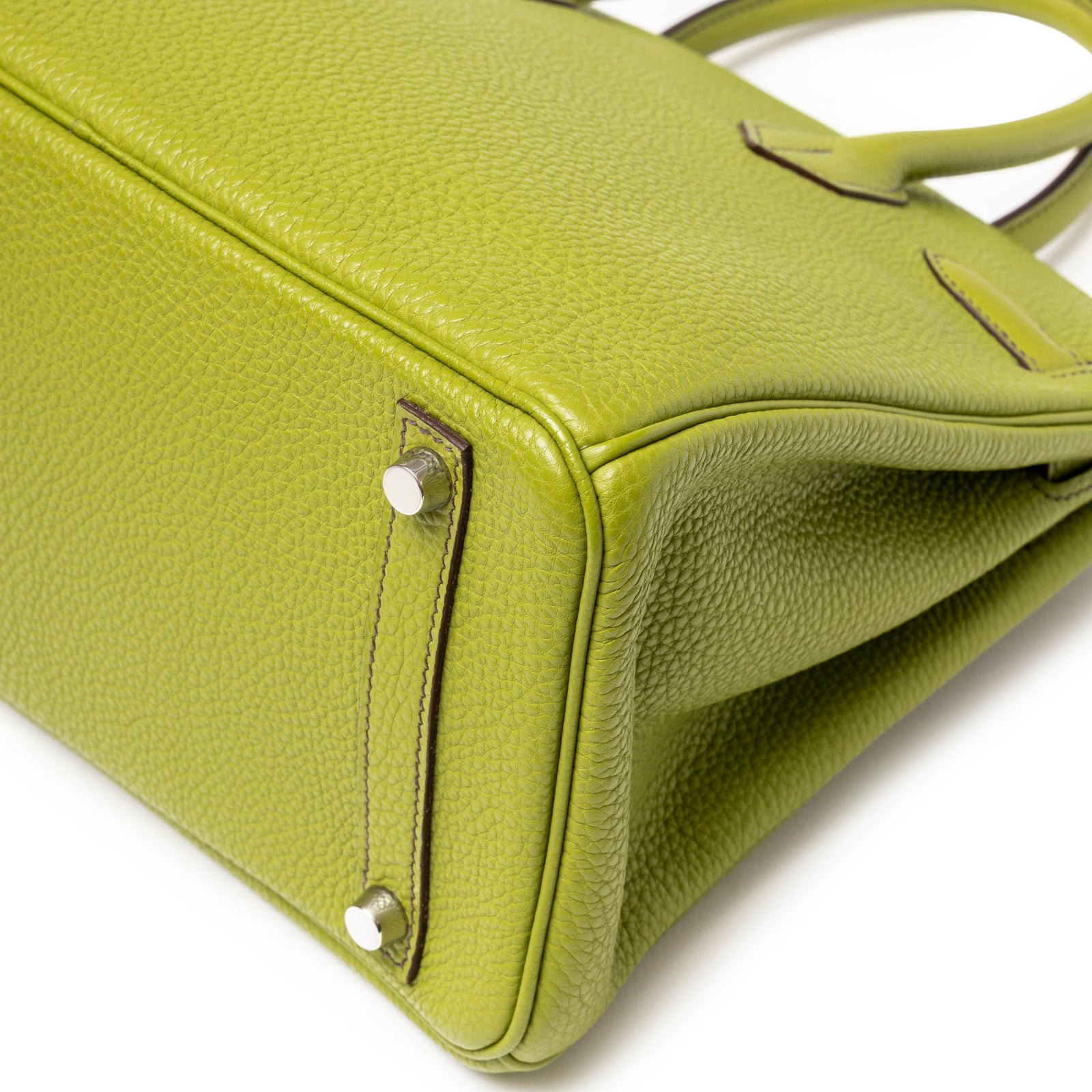 Close-up of base detail on Hermès Birkin 30 Vert Anis Togo Palladium Hardware showing leather grain and feet