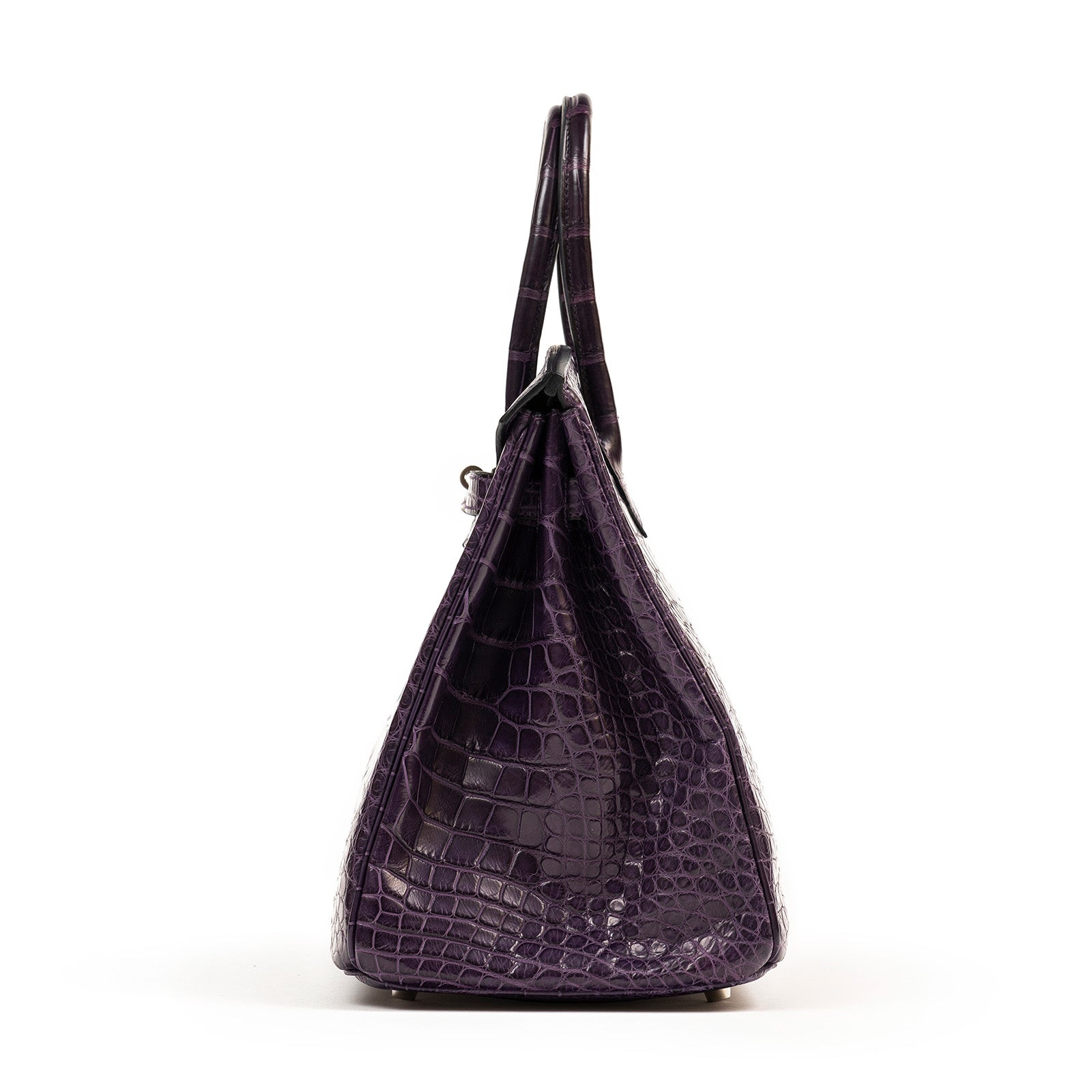 Side view of Hermès Birkin 35 Amethyste Matte Alligator with palladium hardware showing textured leather pattern.