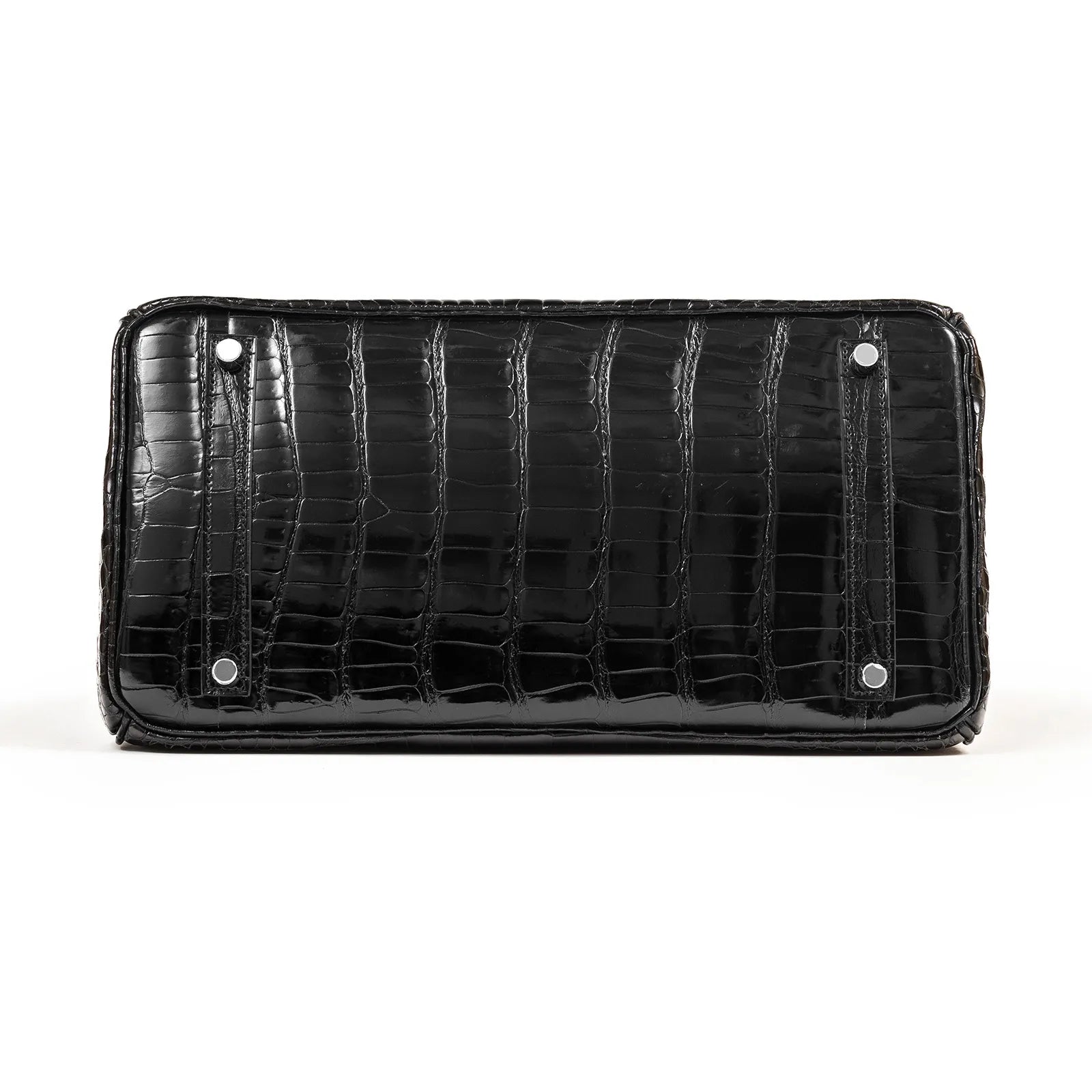 Bottom view of Hermès Birkin 35 Black Shiny Porosus leather featuring palladium hardware feet details.