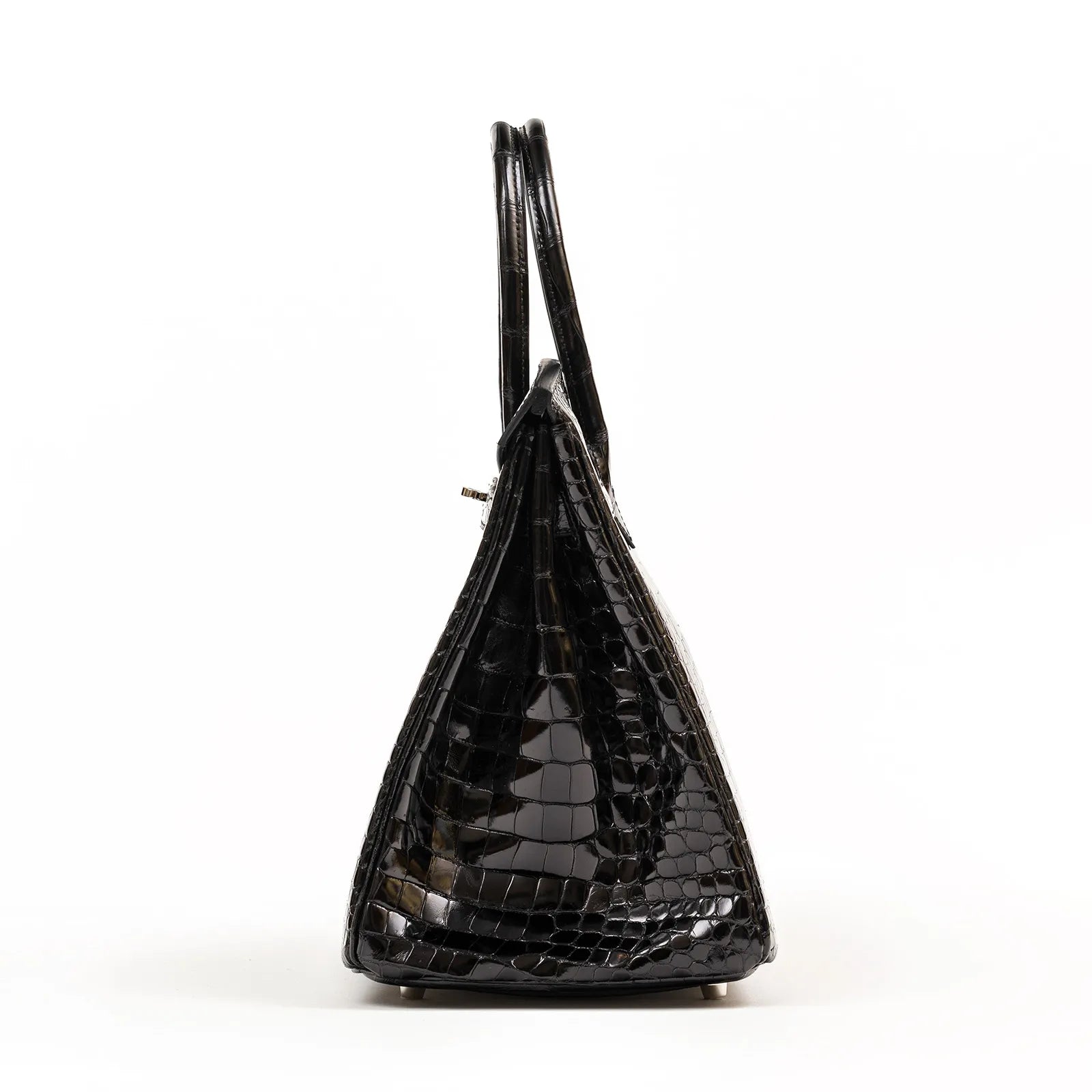 Side view of Hermès Birkin 35 Black Shiny Porosus crocodile leather with palladium hardware.