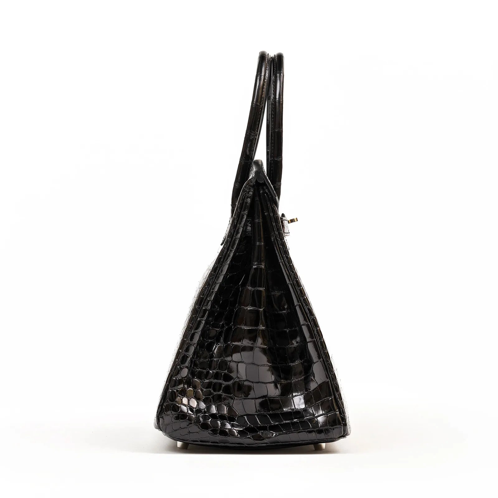 Side view of Hermès Birkin 35 Black Shiny Porosus with palladium hardware showing sleek crocodile texture.