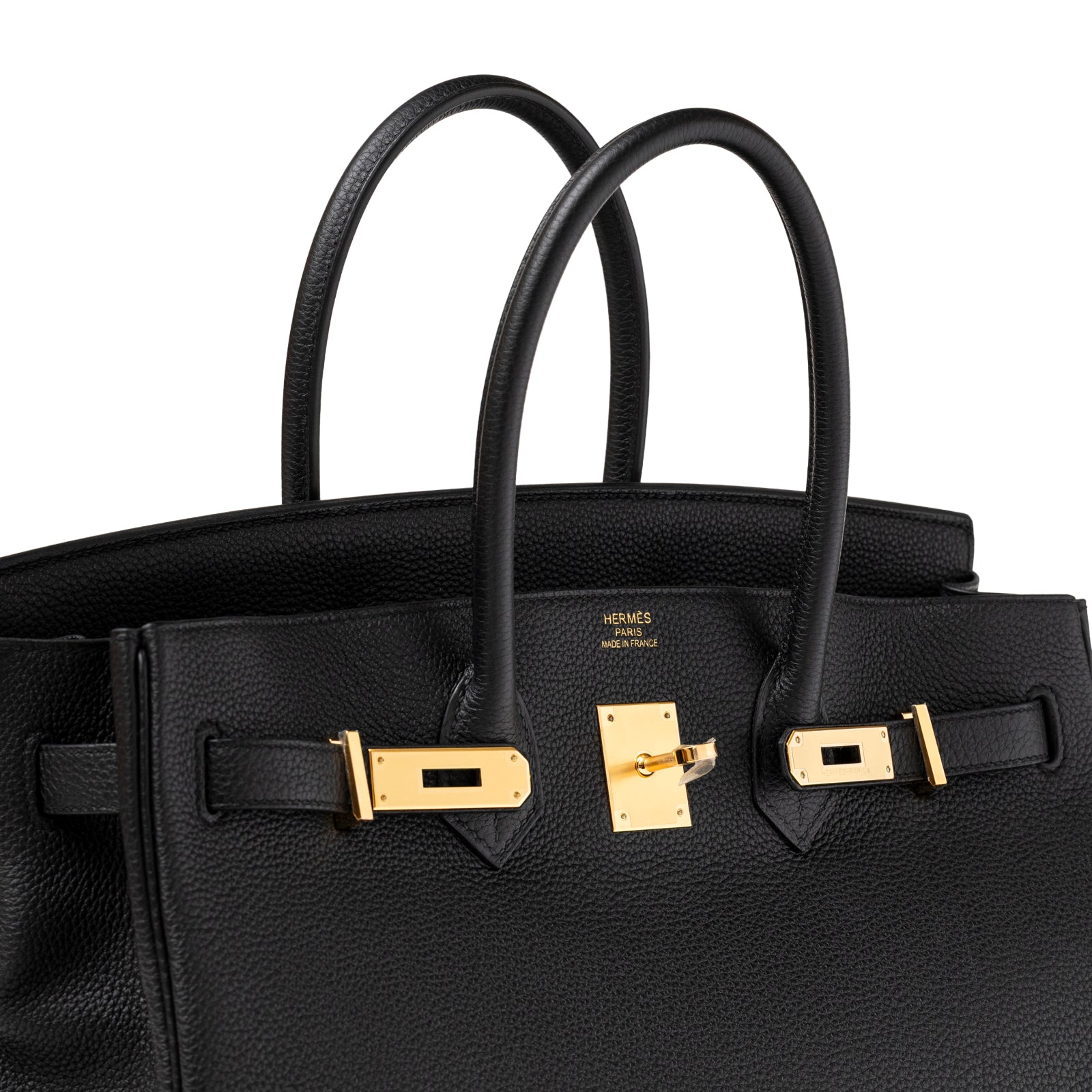 Close-up of Hermès Birkin 35 Black Togo Gold Hardware highlighting polished gold clasp and textured pebbled leather handles