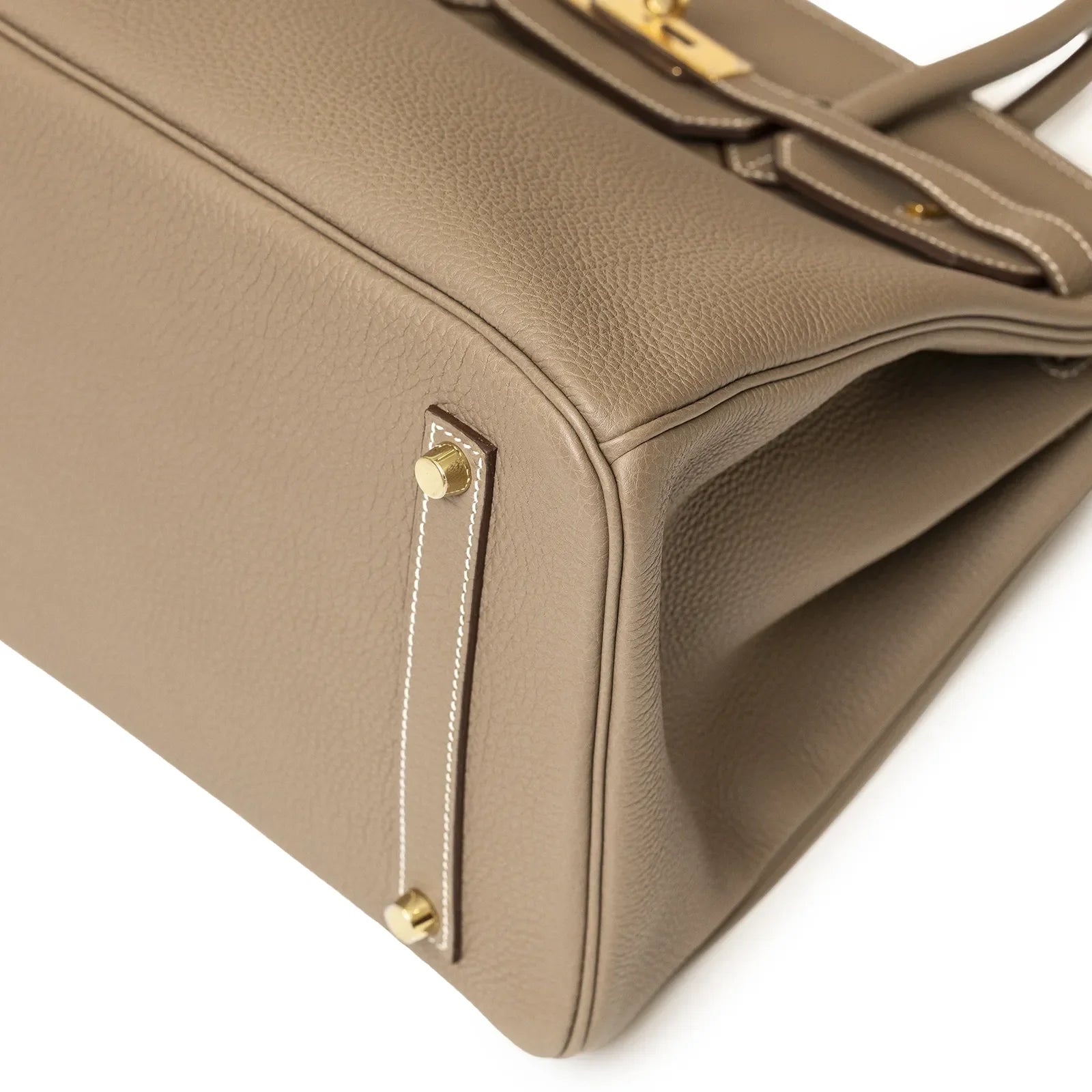 Close-up of Hermès Birkin 35 Etoupe Togo Gold Hardware showing bottom corner and stitching details.