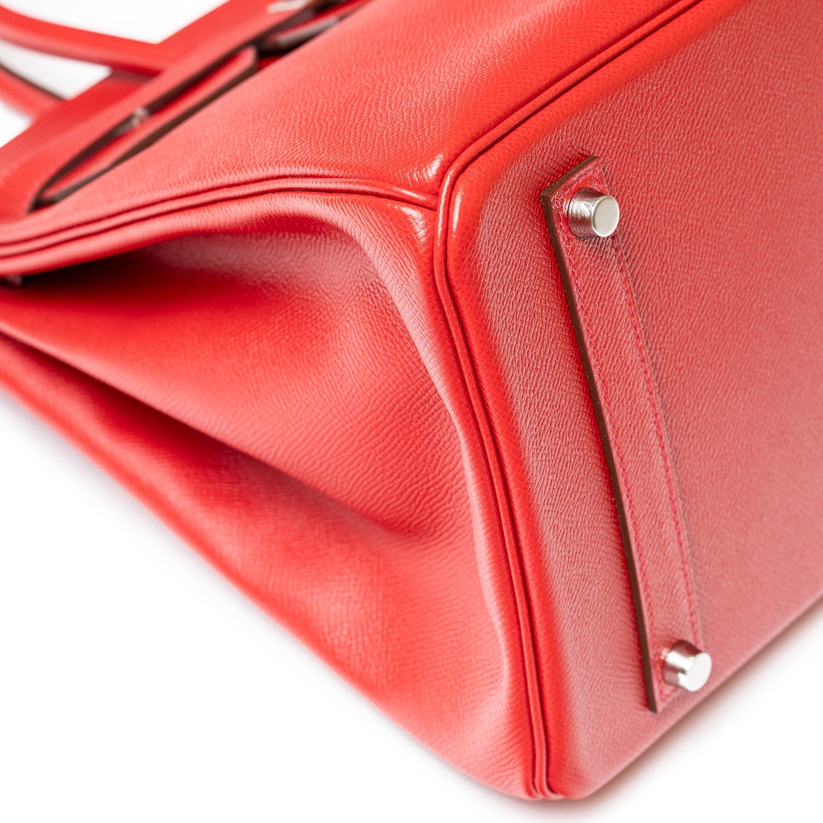 Close-up of bottom corner and palladium hardware on Hermès Birkin 35 Rouge Casaque Epsom leather bag