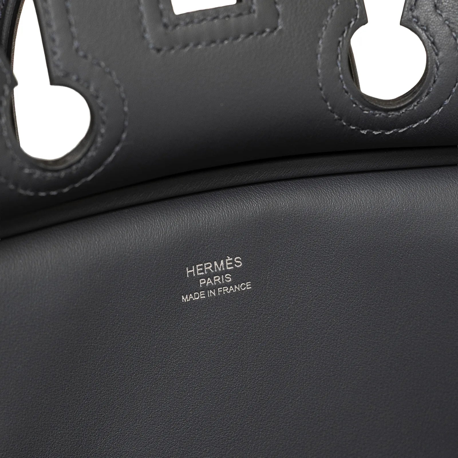 Close-up of Hermès Birkin Cargo 25 Gris Misty Swift leather interior with embossed Hermès Paris Made in France logo