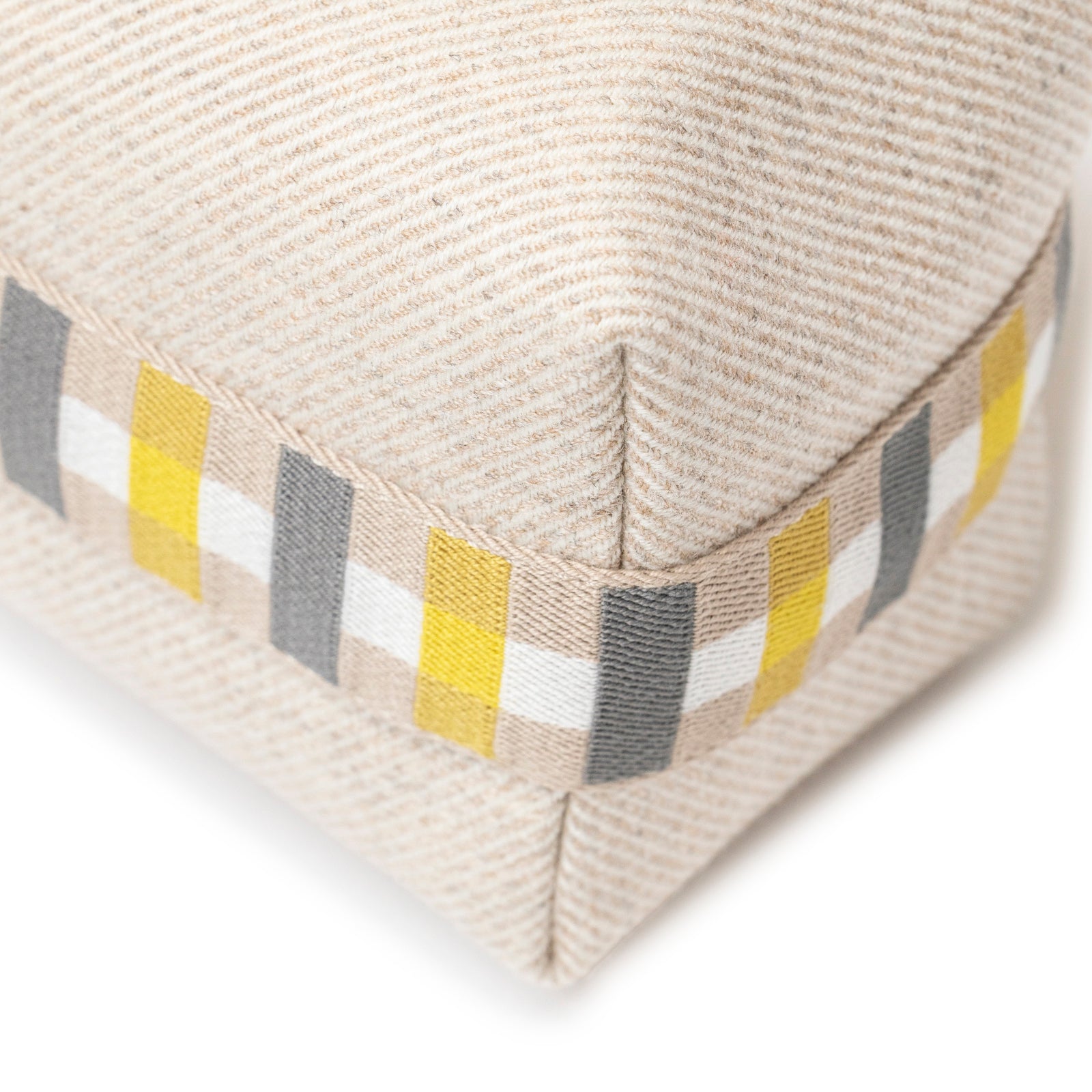 Close-up angled shot of Hermès Bride-a-Brac au Carre Case Small Model Seigle fabric corner with striped accent detail
