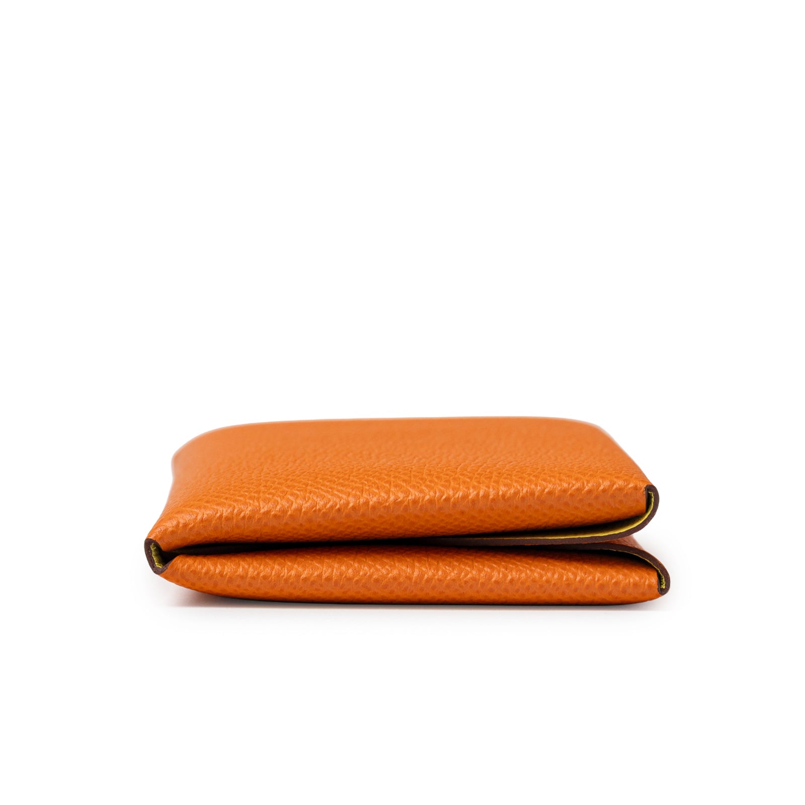 Side view of Hermès Calvi Duo Compact Verso Card Holder Orange Lime Epsom Palladium Hardware showing texture