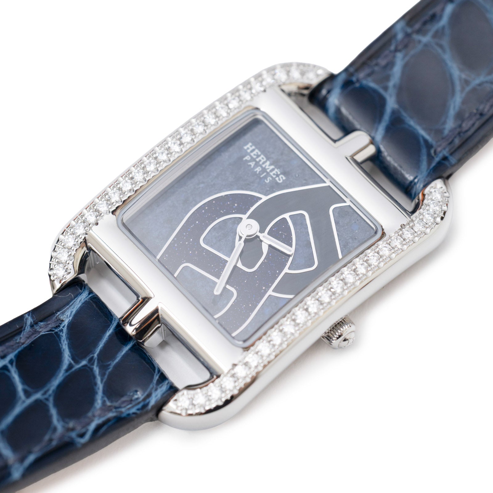 Close-up angled shot of Hermès Cape Cod Diamond Watch Small Model 31mm Steel/Shiny Alligator Blue Saphir showing diamond bezel and blue dial