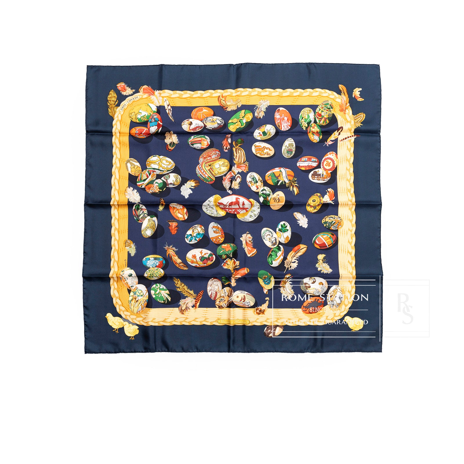 Top-down view of Hermès Carre 90 Couvee d'Silk Scarf Blue Multi featuring colorful design on navy background with gold border