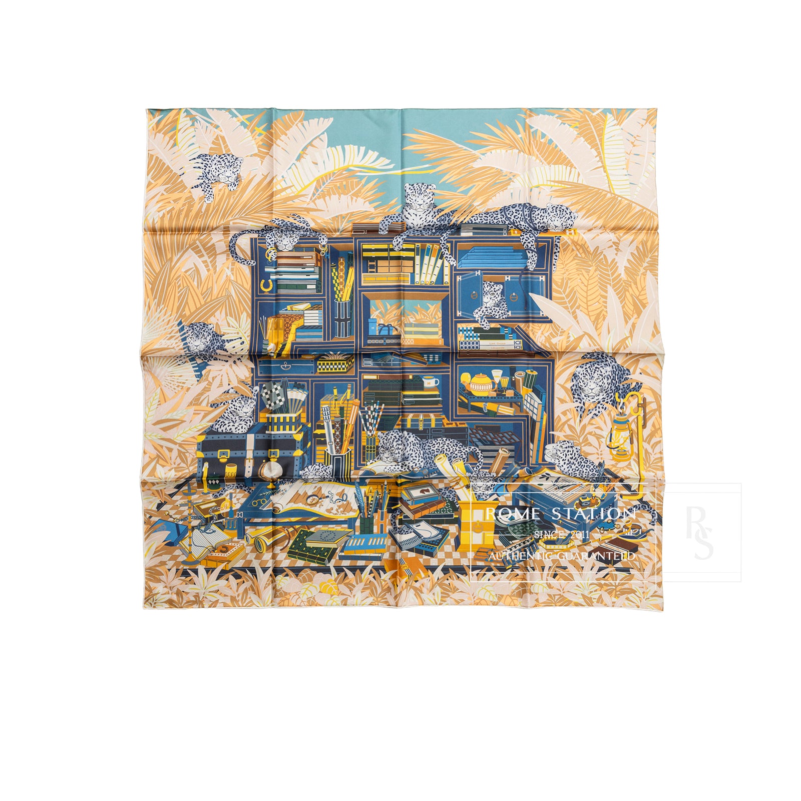 Top-down view of Hermès Carre 90 Double Face Les Douze Leopards Blue Beige Jaune scarf with detailed leopard and foliage design