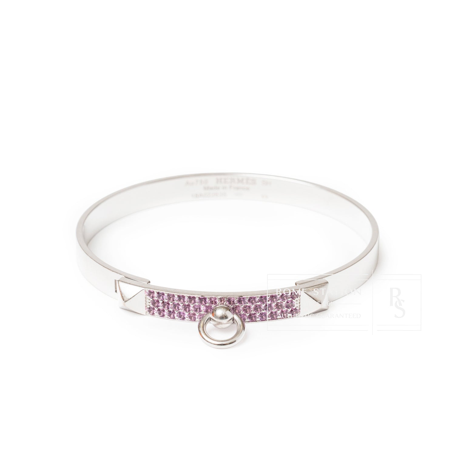 Front angled view of Hermès Collier de Chien Bracelet Small Model 18K White Gold Pink Sapphire with pink gems and ring detail