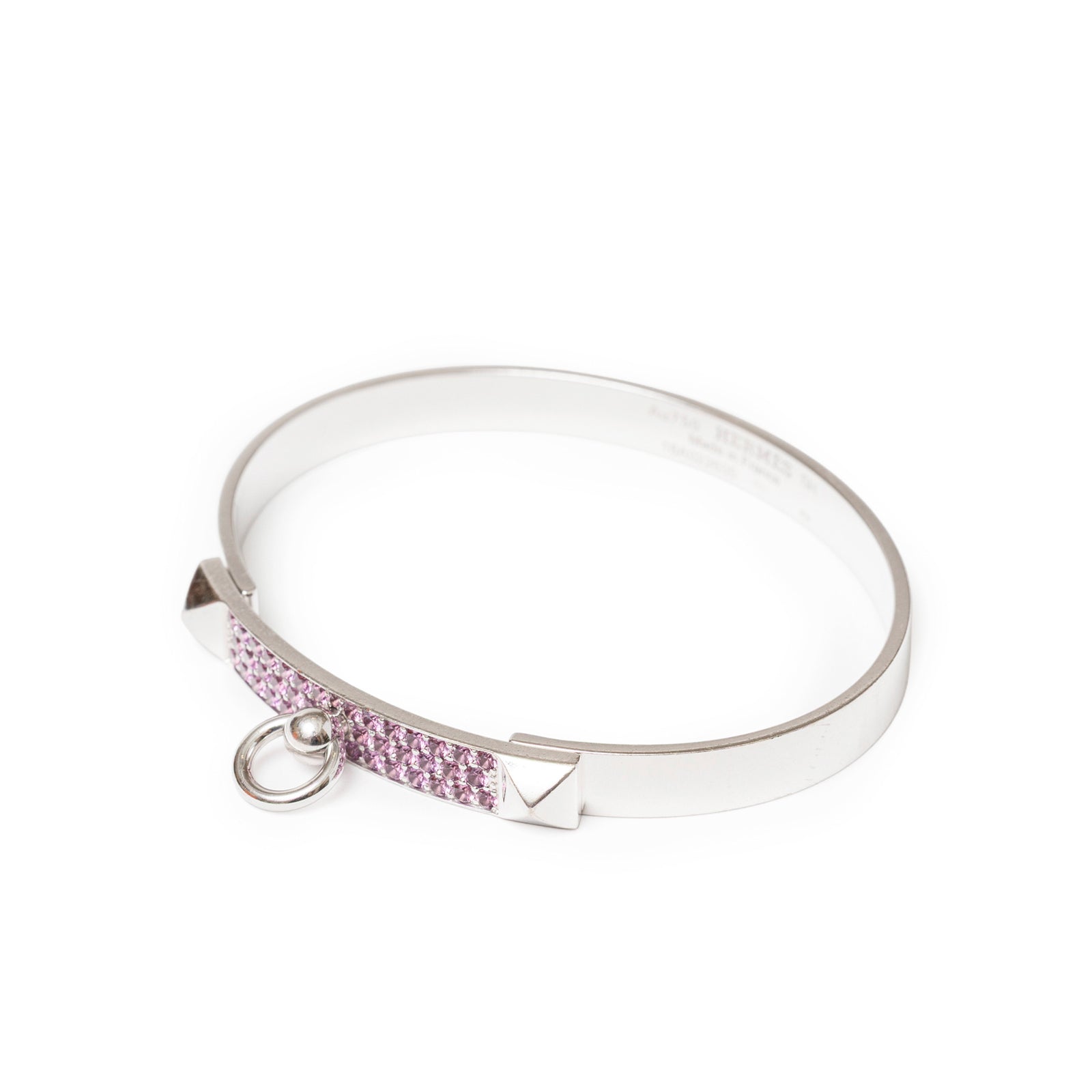 Angled view of Hermès Collier de Chien Bracelet Small Model 18K White Gold Pink Sapphire with pavé stones and ring detail