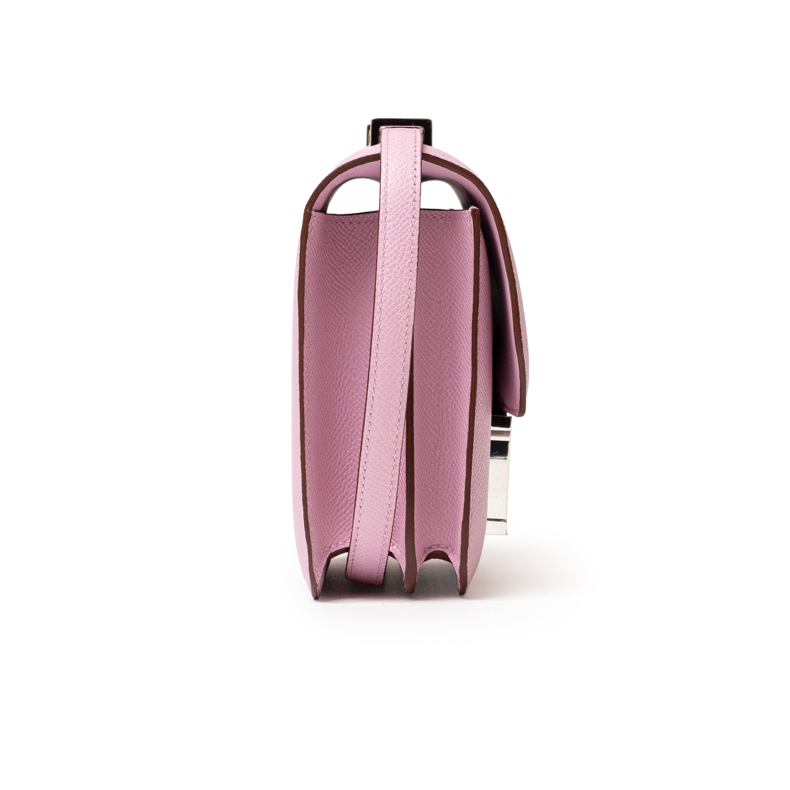 Side angle of Hermès Constance 18 Mauve Sylvester Epsom Palladium showing structured leather and slim strap