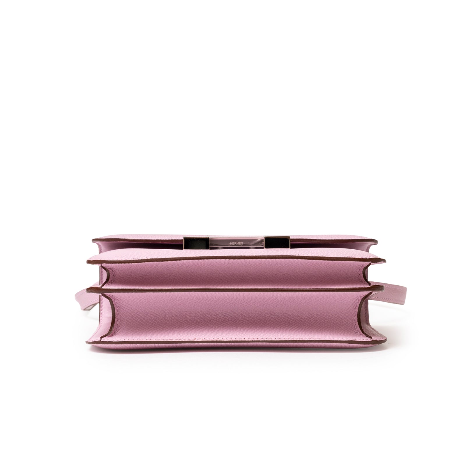 Bottom of Hermès Constance 18 Mauve Sylvester Epsom Palladium showing layered leather compartments and slim silhouette