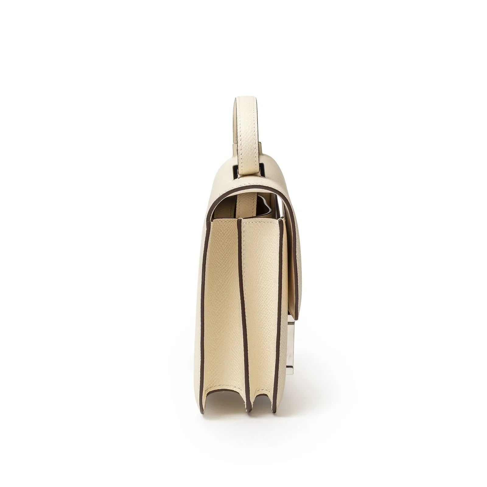 Side view of Hermès Mini Constance 18 Nata Epsom Palladium Hardware showing slim profile and crisp edges
