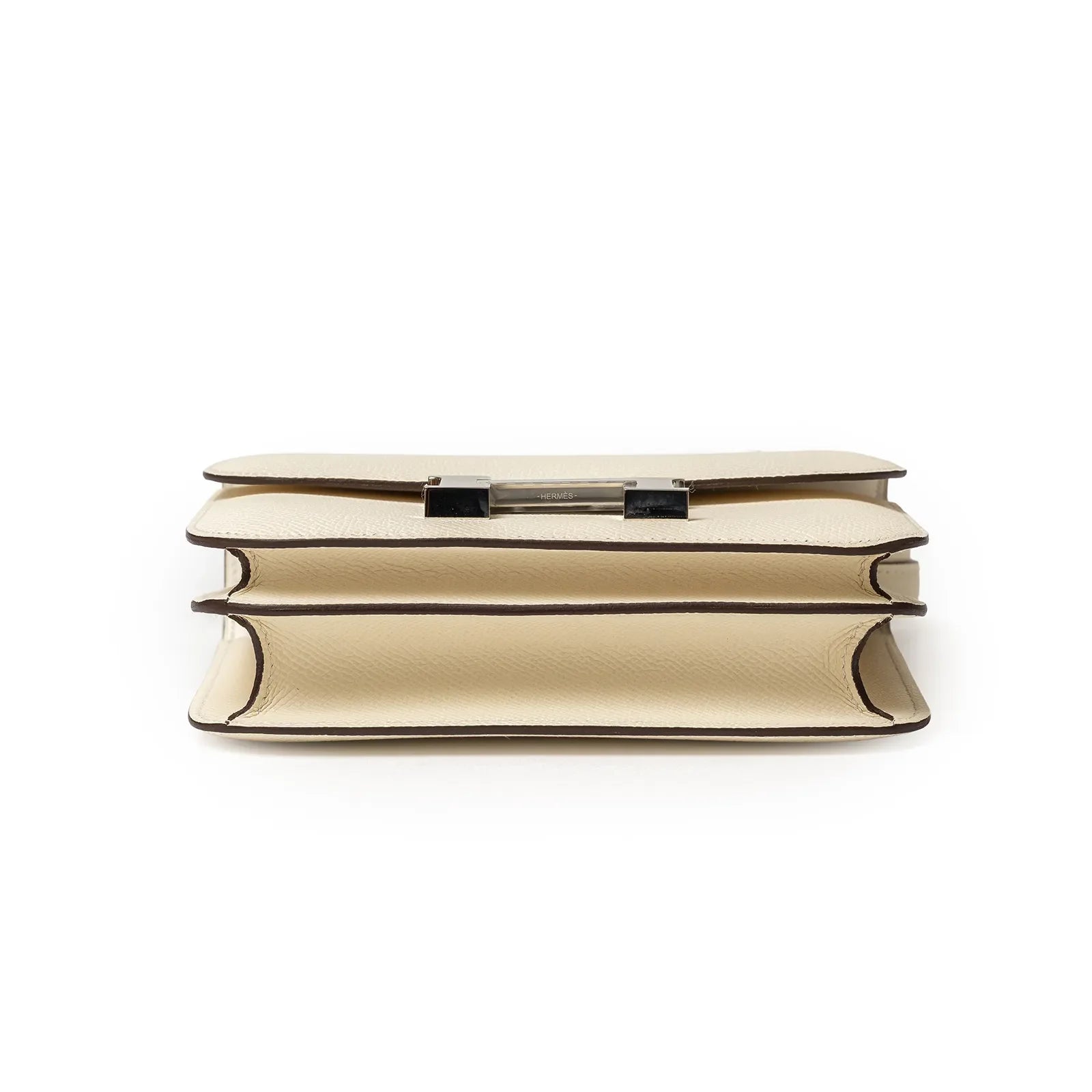 Bottom view of Hermès Mini Constance 18 Nata Epsom Palladium Hardware showing layered compartments and texture detail