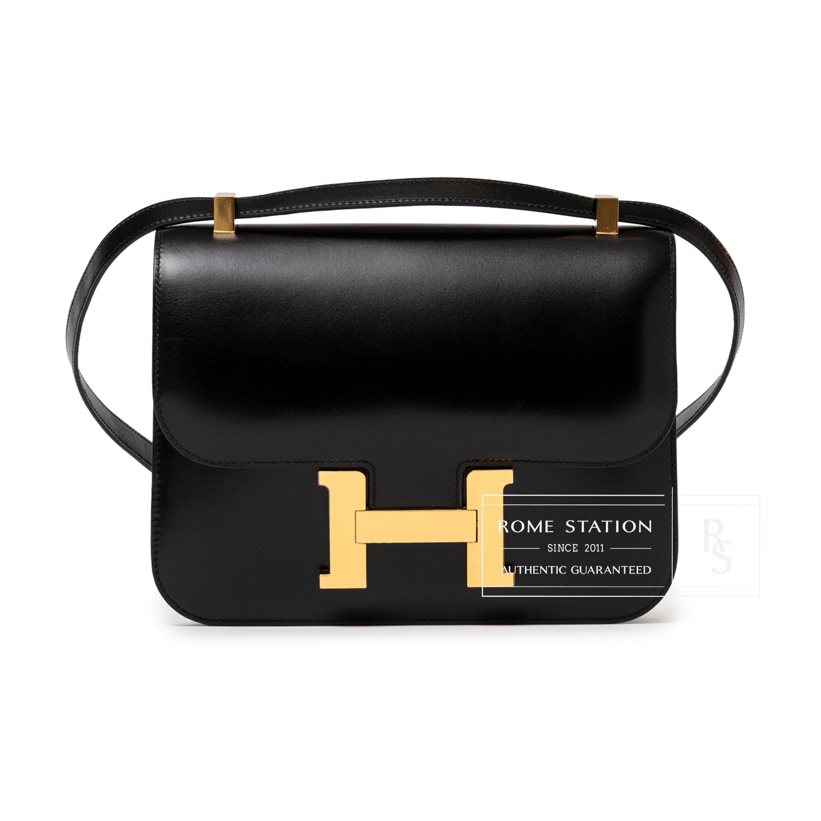 Front view of Hermès Constance 24 Black Box Gold Hardware showing smooth leather and signature gold clasp detail