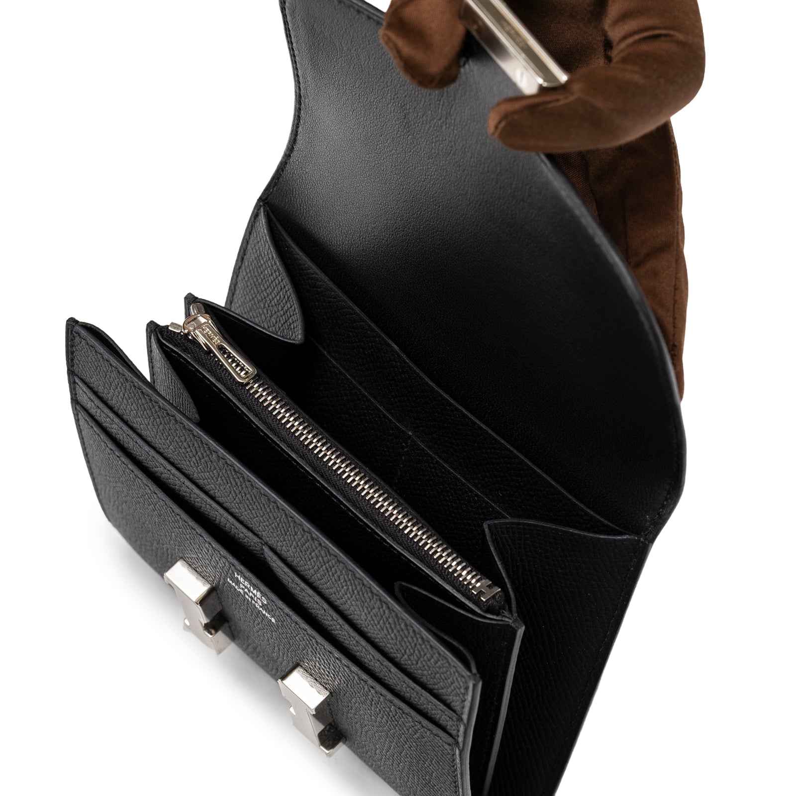Open view of Hermès Constance Compact Wallet Black Epsom Palladium Hardware showing interior compartments and zipper pocket