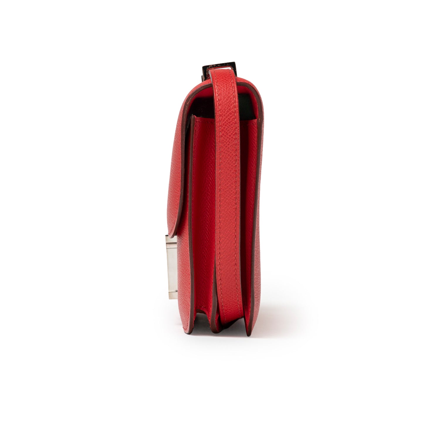 Side profile of Hermès Constance Elan Rouge Epsom Palladium Hardware showing slim red leather and strap edge details