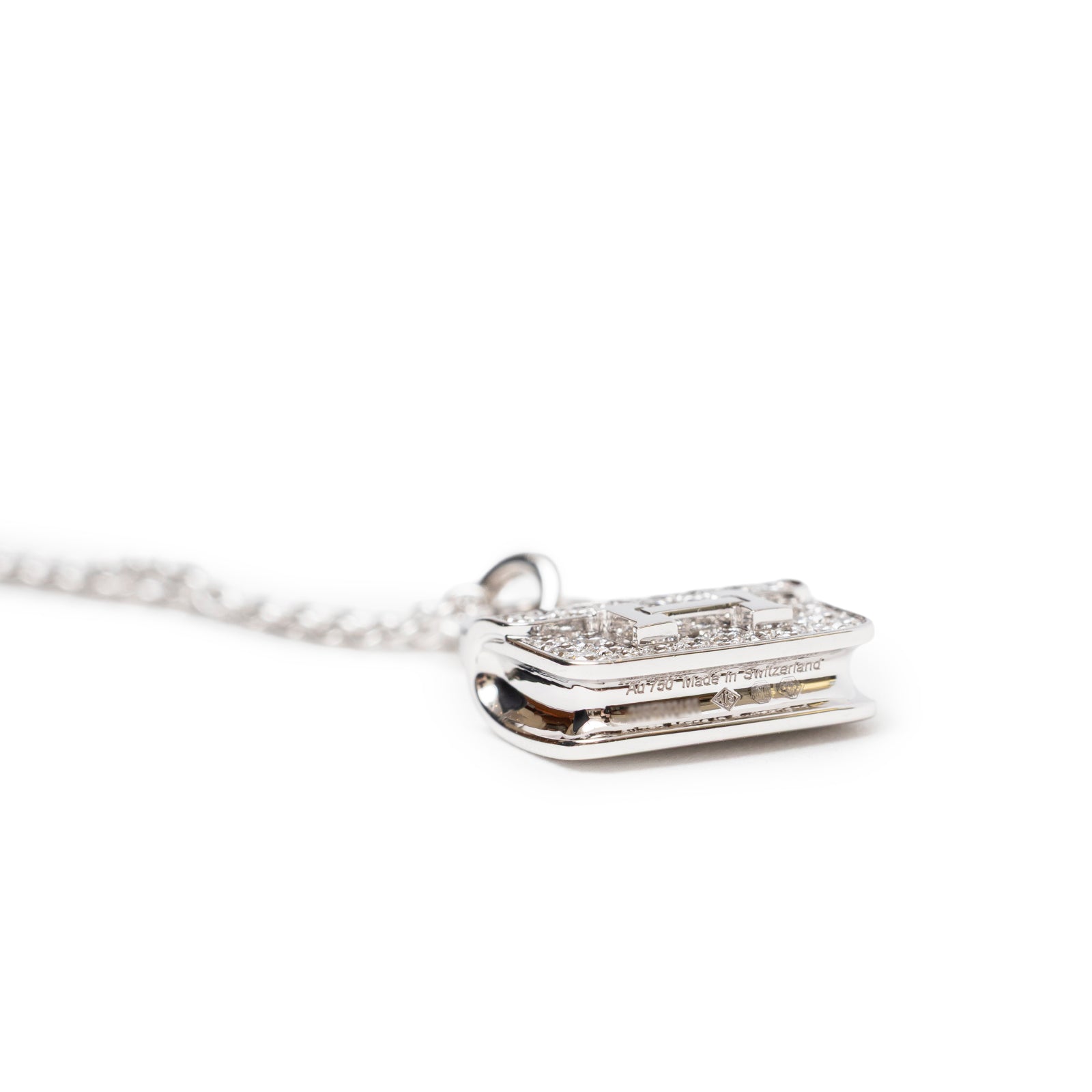 Bottom close-up of Hermès Constance Pendant 18K White Gold and Diamonds showcasing intricate diamond detail