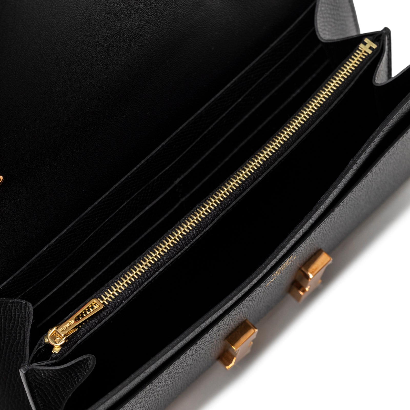 Interior close-up of Hermès Constance To Go Wallet Black Epsom Rose Gold Hardware showing zipper and card slots detail