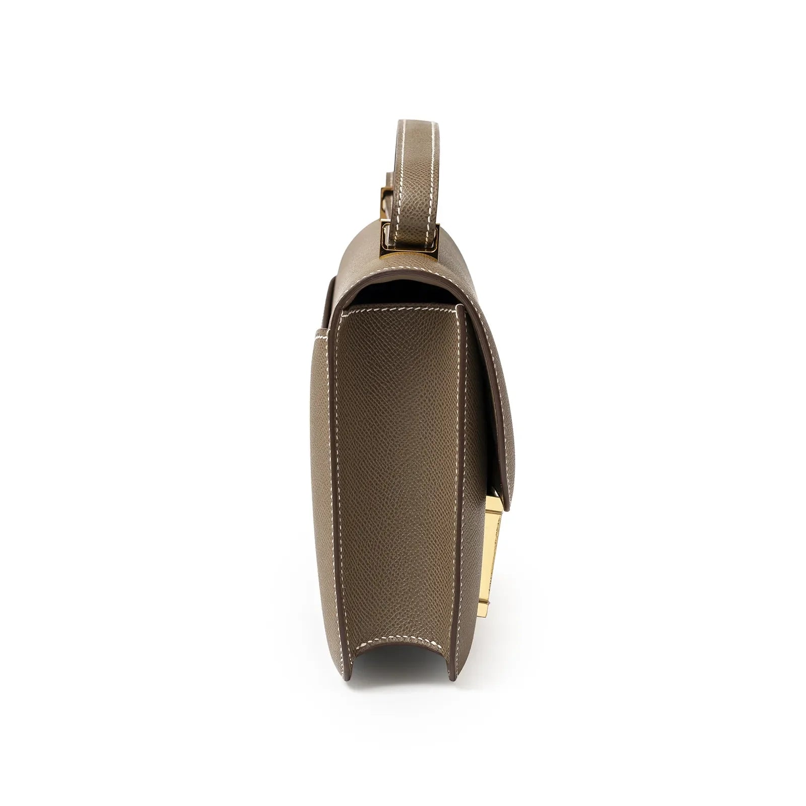 Side view of Hermès Constance 24 Etoupe Epsom Gold Hardware showing textured leather and structured silhouette
