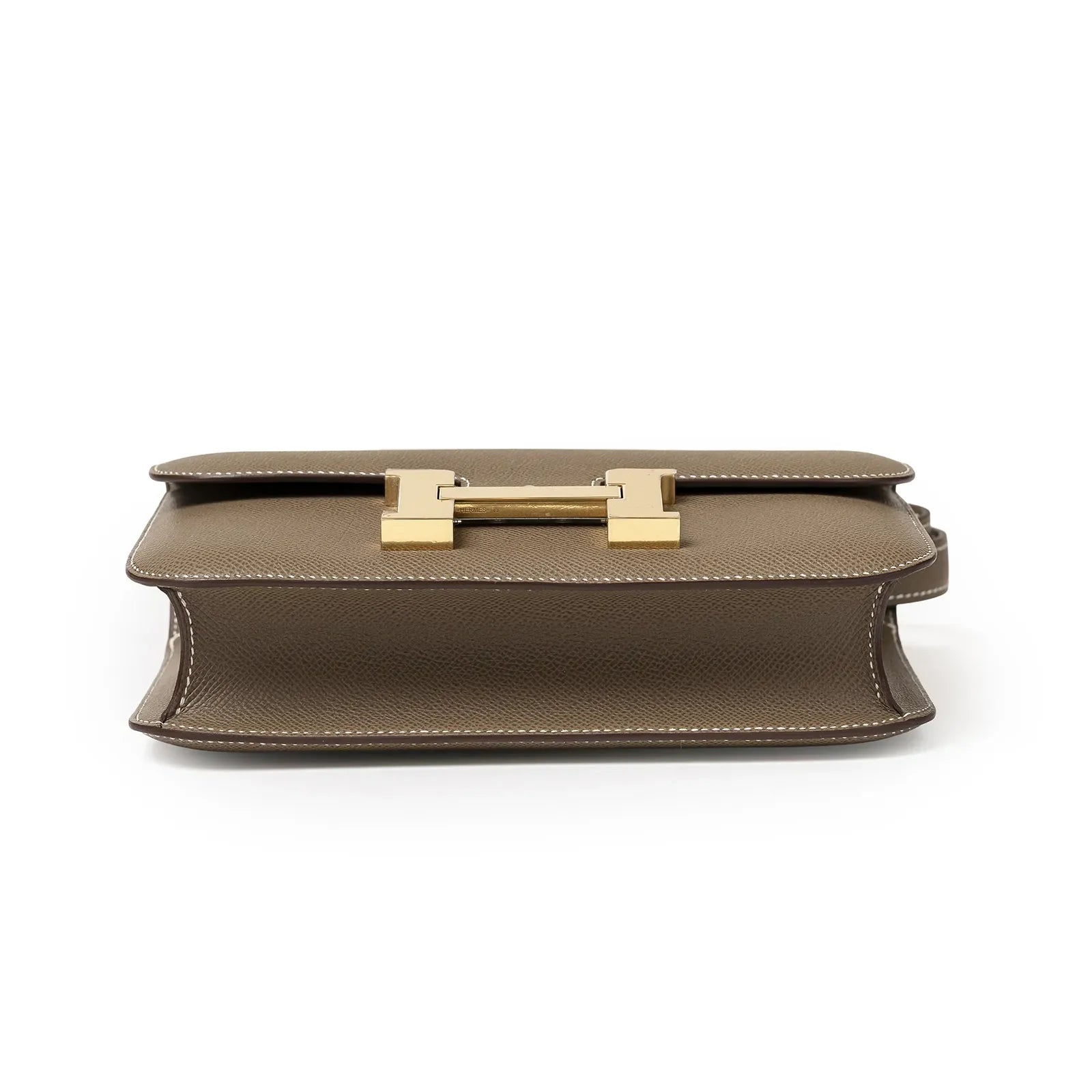 Bottom view of Hermès Constance 24 Etoupe Epsom Gold Hardware showing structured leather and stitching details