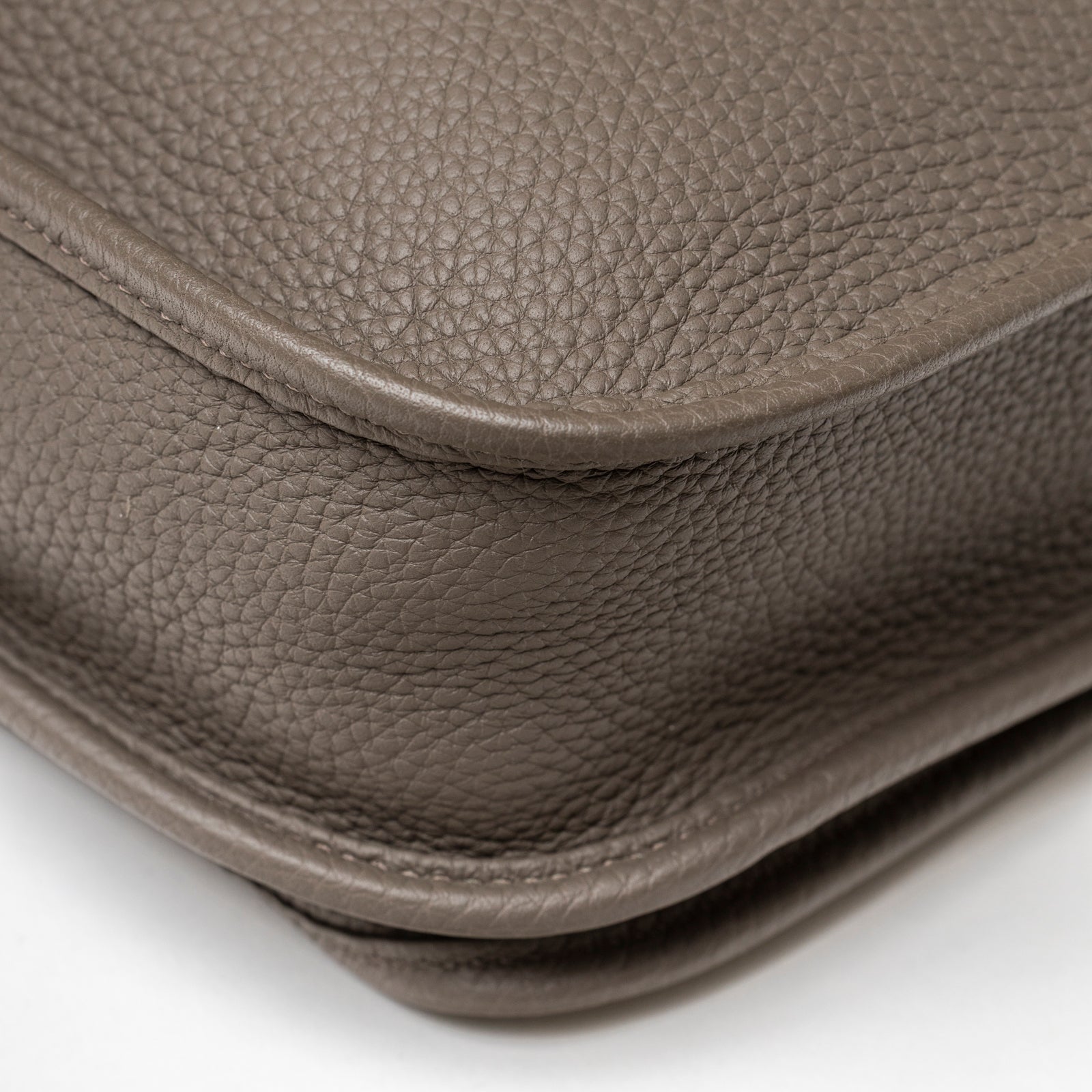 Close-up of Hermès Evelyne PM 29 Etain Clemence Palladium Hardware showing textured Clemence leather and edge stitching detail