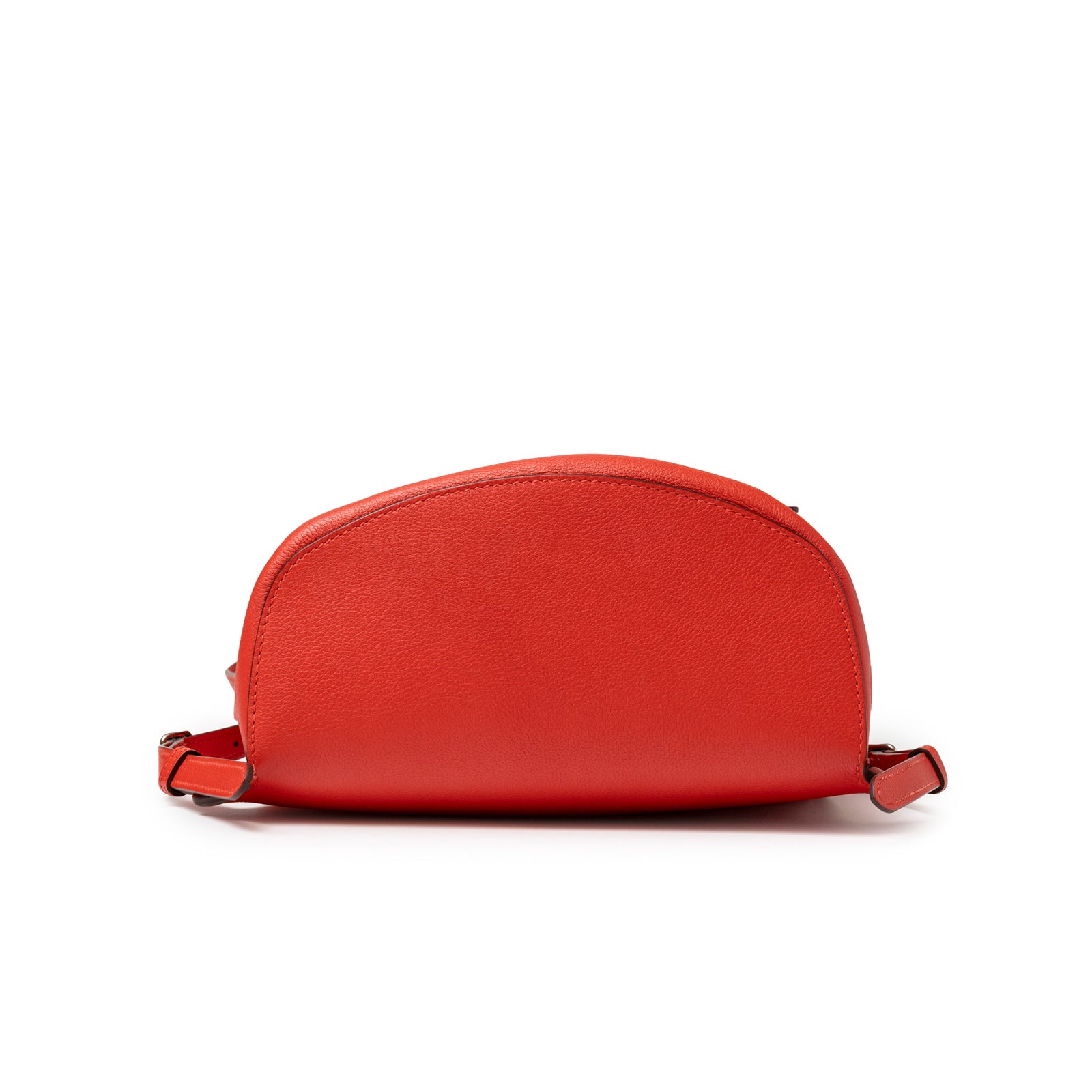 Bottom view of Hermès Gr24 Backpack Rouge Tomate Evercolor Palladium Hardware showing curved leather base detail