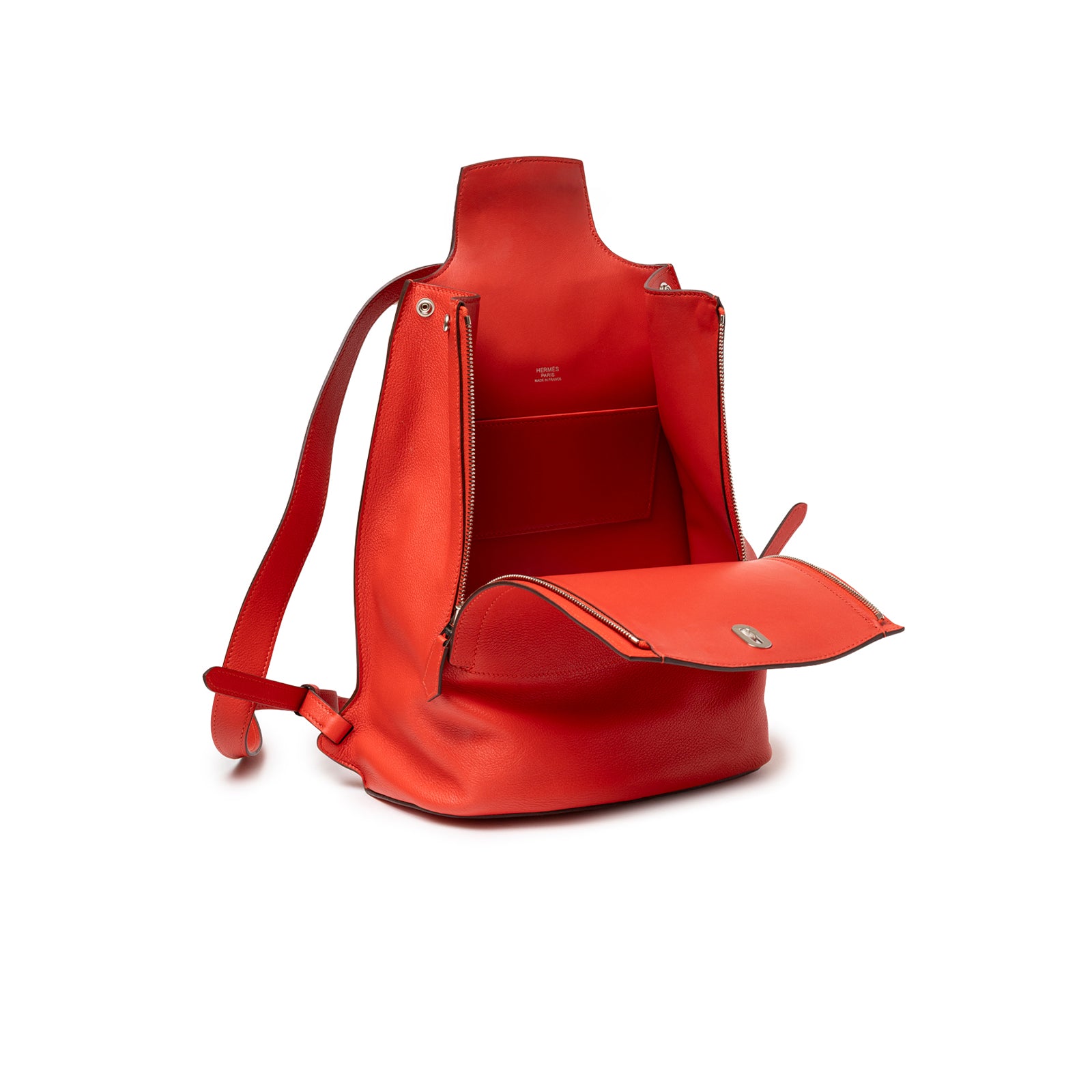 Interior view of Hermès Gr24 Backpack Rouge Tomate Evercolor Palladium Hardware showing open flap and spacious leather compartment
