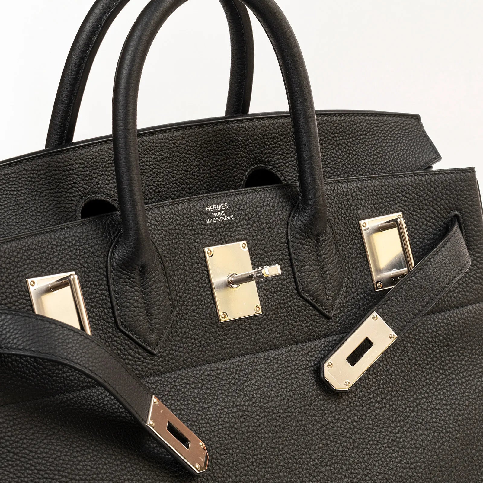 Close-up of Hermès Hac Birkin 40 Black Togo leather showing palladium hardware and handle details.