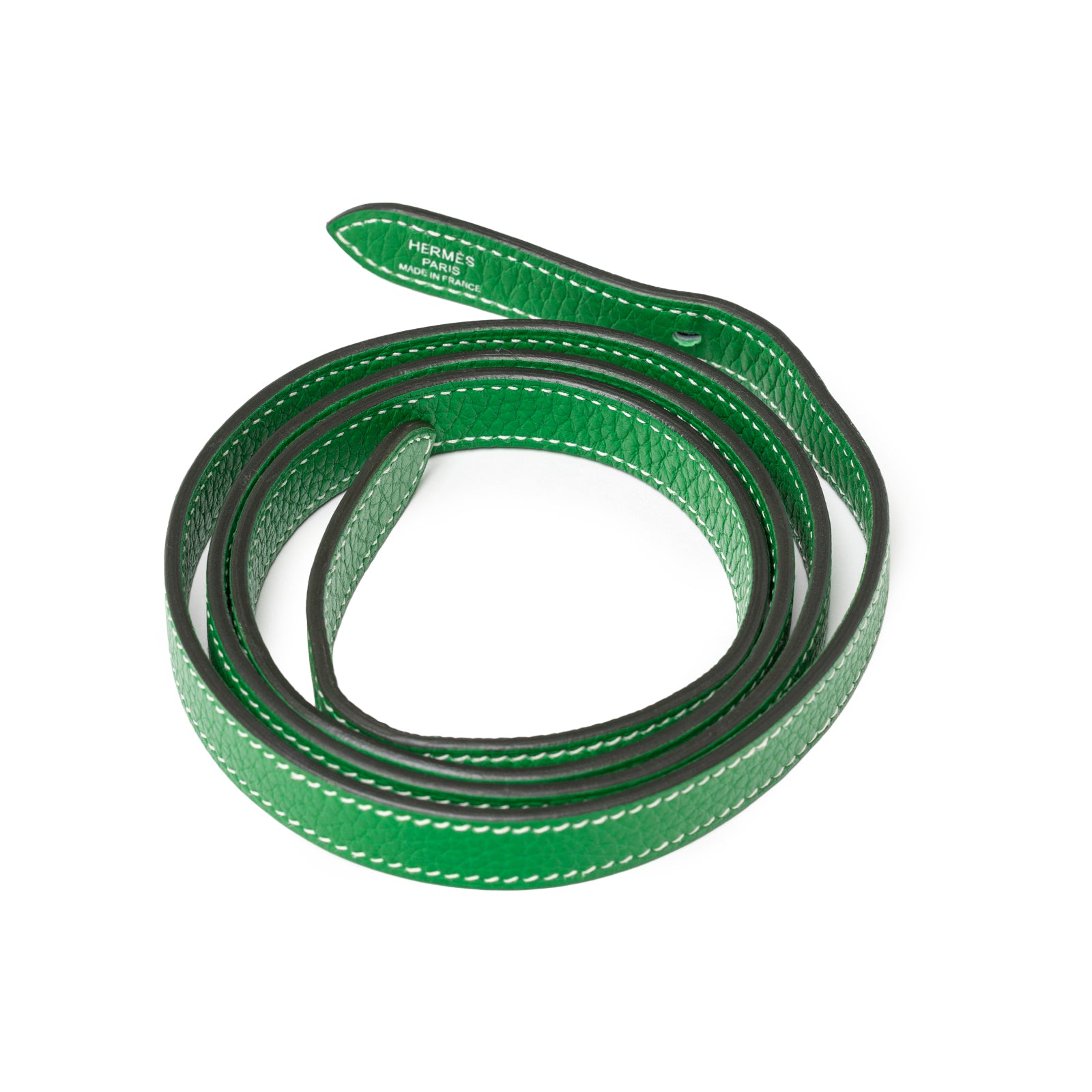 Coiled vibrant green leather strap with white stitching and embossed Hermès Paris on Hermès Halzan 31 Bambou Clemence Palladium Hardware