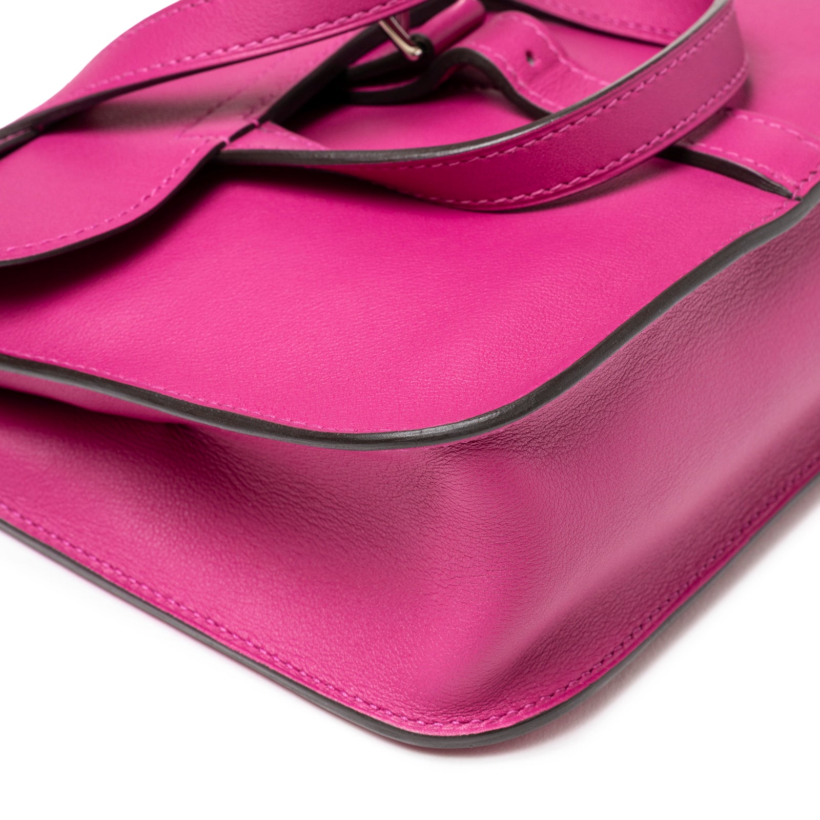 Close-up of Hermès Halzan Mini Rose Pourpre Swift Palladium Hardware showing smooth leather and strap detail from top angle