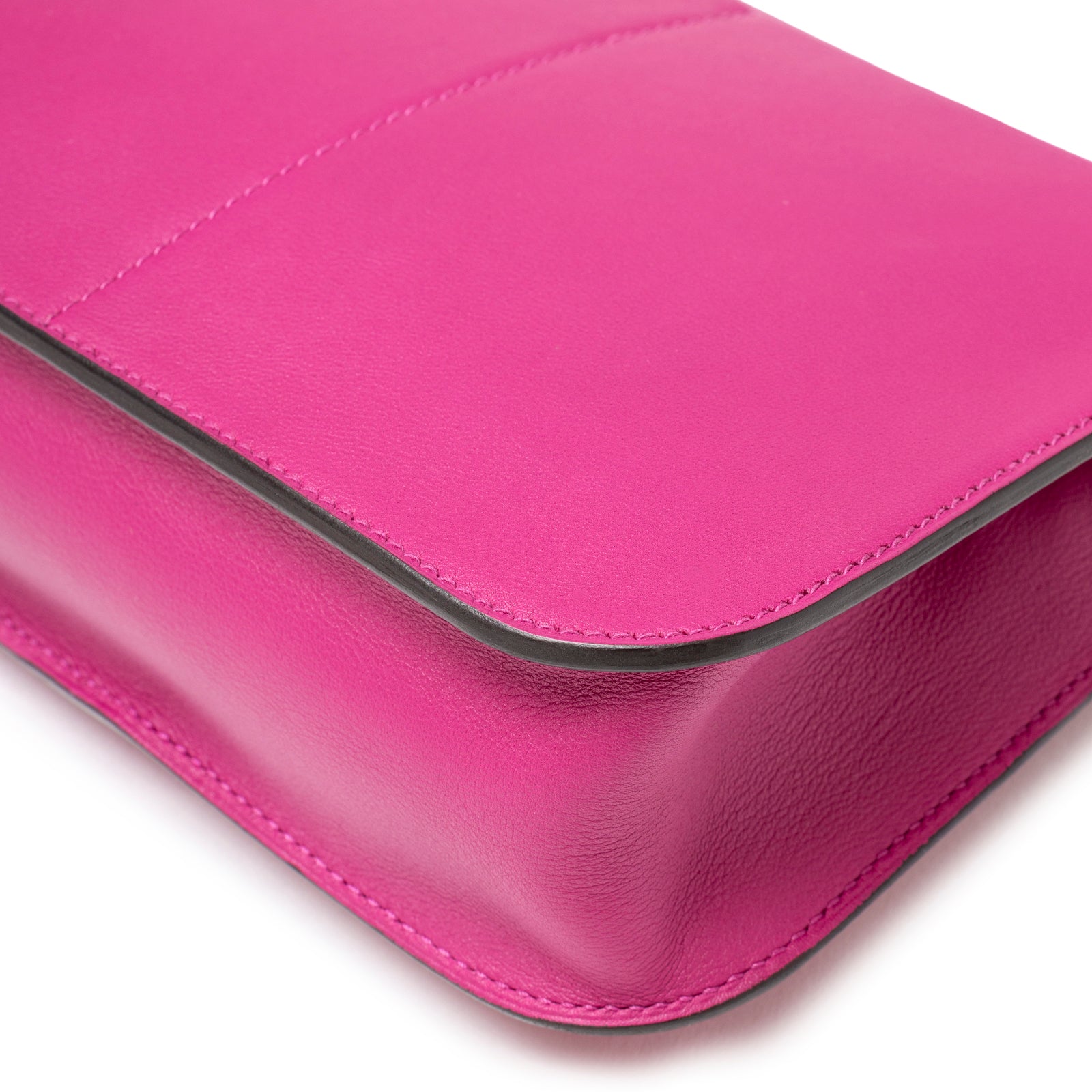 Close-up of Hermès Halzan Mini Rose Pourpre Swift Palladium Hardware showing vibrant leather and fine edge detail