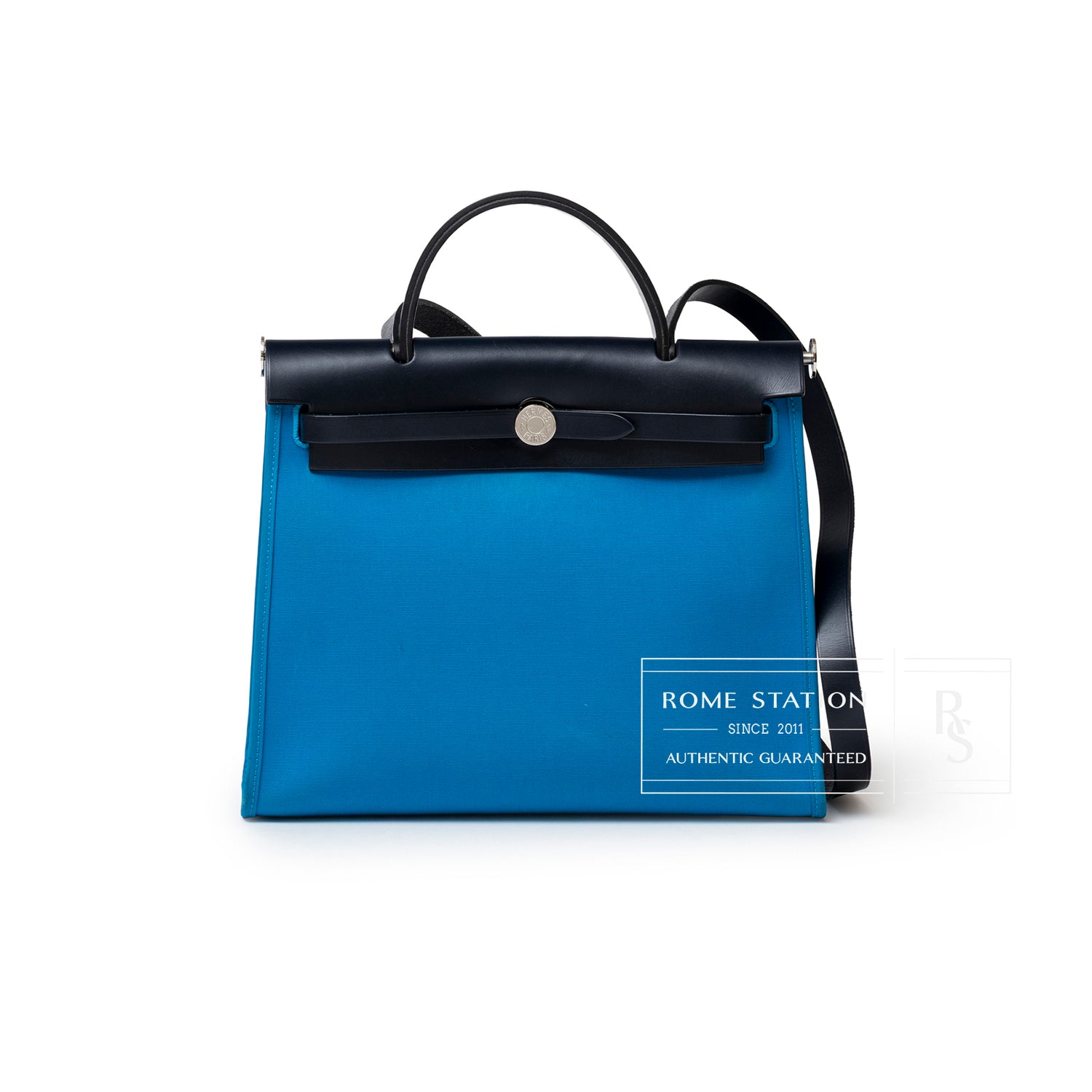 Front view of Hermès Herbag Zip PM 31 Blue Vache Hunter Palladium Hardware with blue canvas and black leather trim