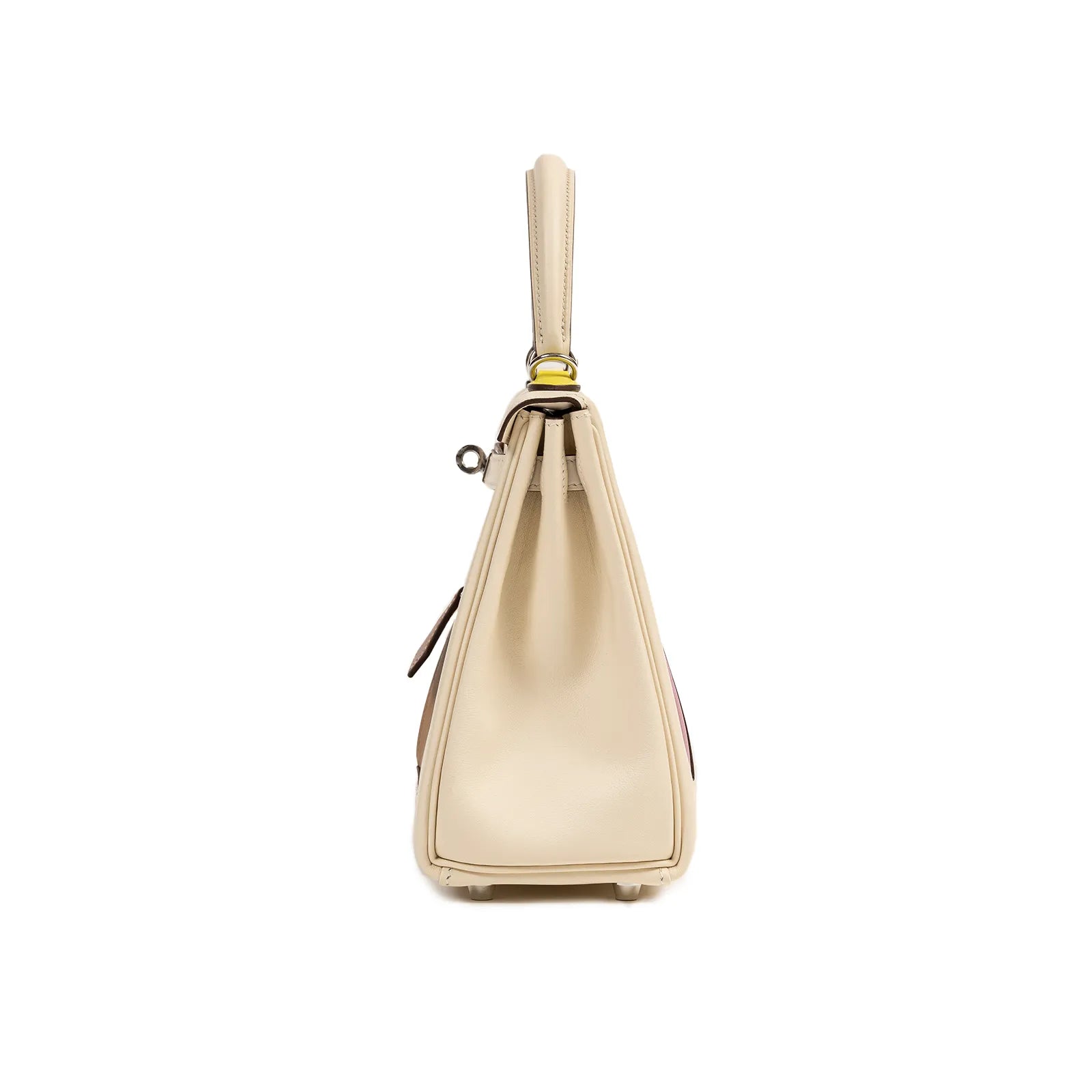Side profile of Hermès Kelly 25 Colormatic in cream swift leather with palladium hardware