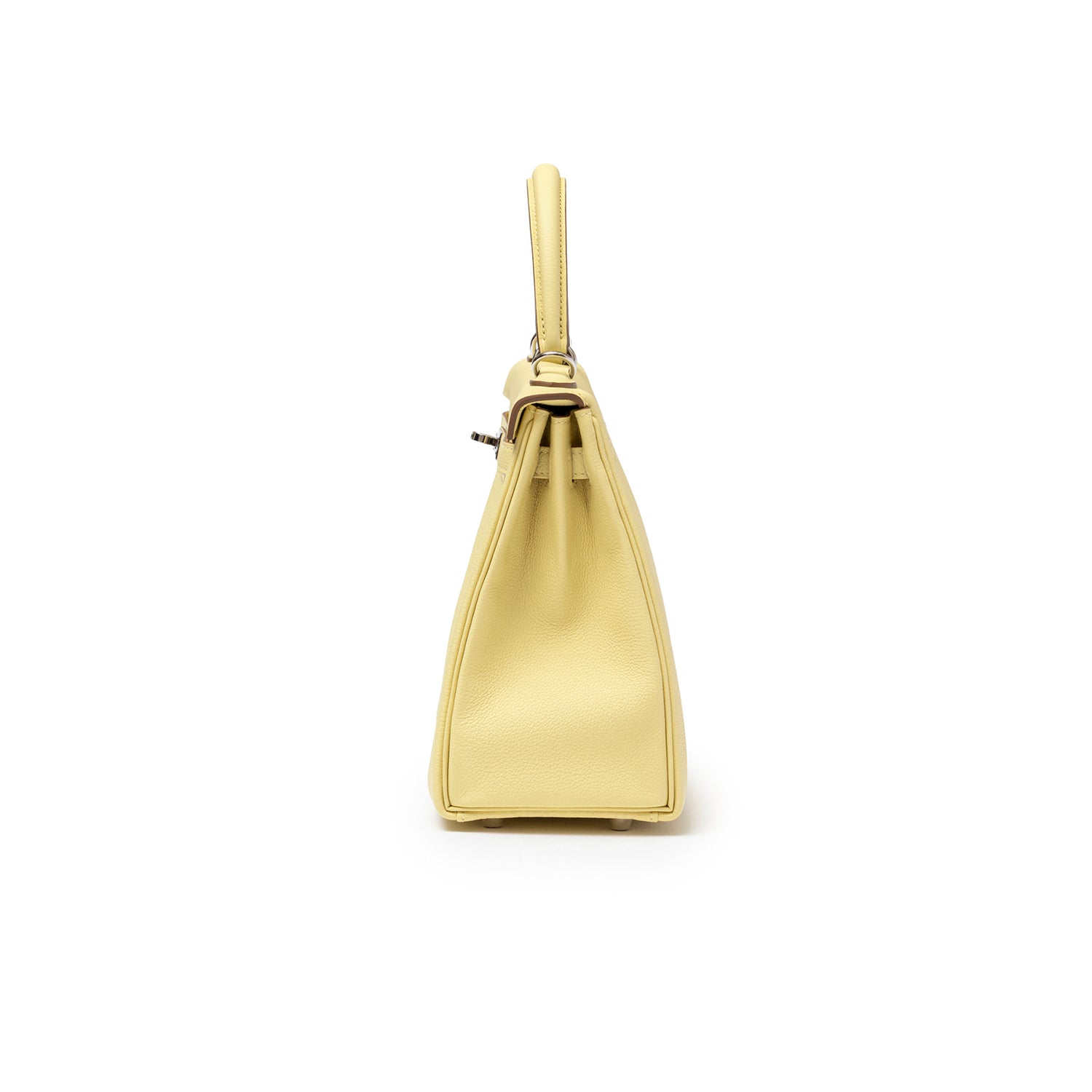 Side view of Hermès Kelly 25 Retourne Togo Jaune Poussin Palladium Hardware showing smooth leather and structured shape