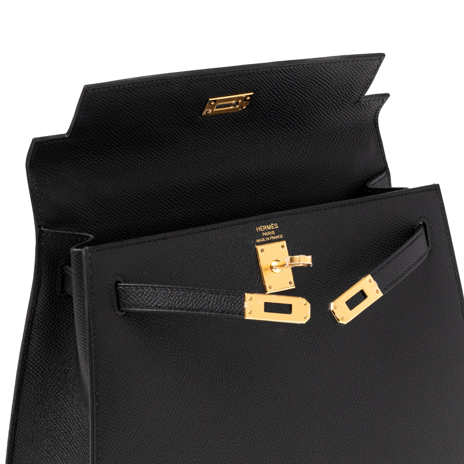 Open top view of Hermès Kelly 25 Sellier Black Epsom Gold Hardware showing interior flap and clasp details