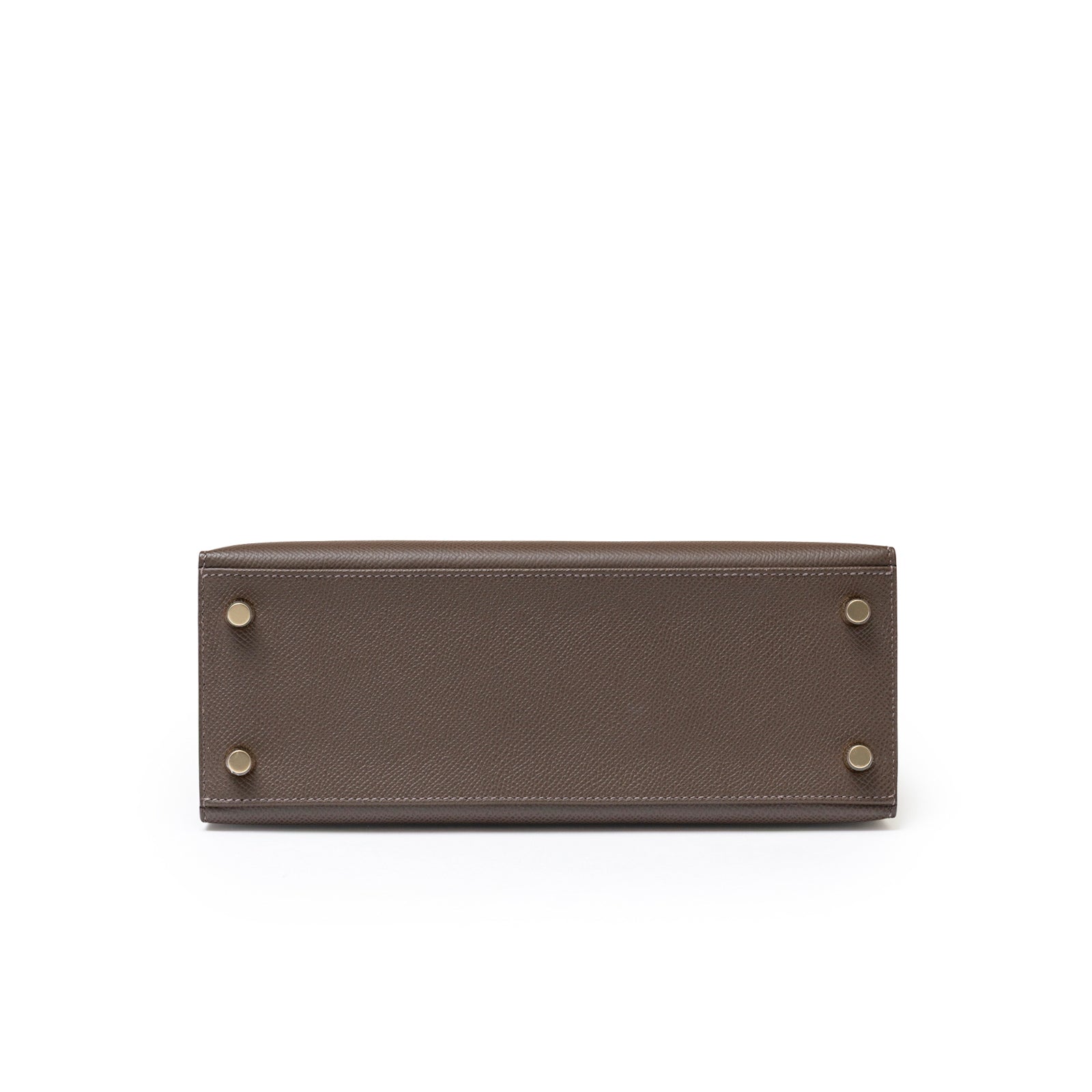 Bottom view of Hermès Kelly 25 Sellier Ecore Epsom Gold Hardware showing protective feet and textured leather base