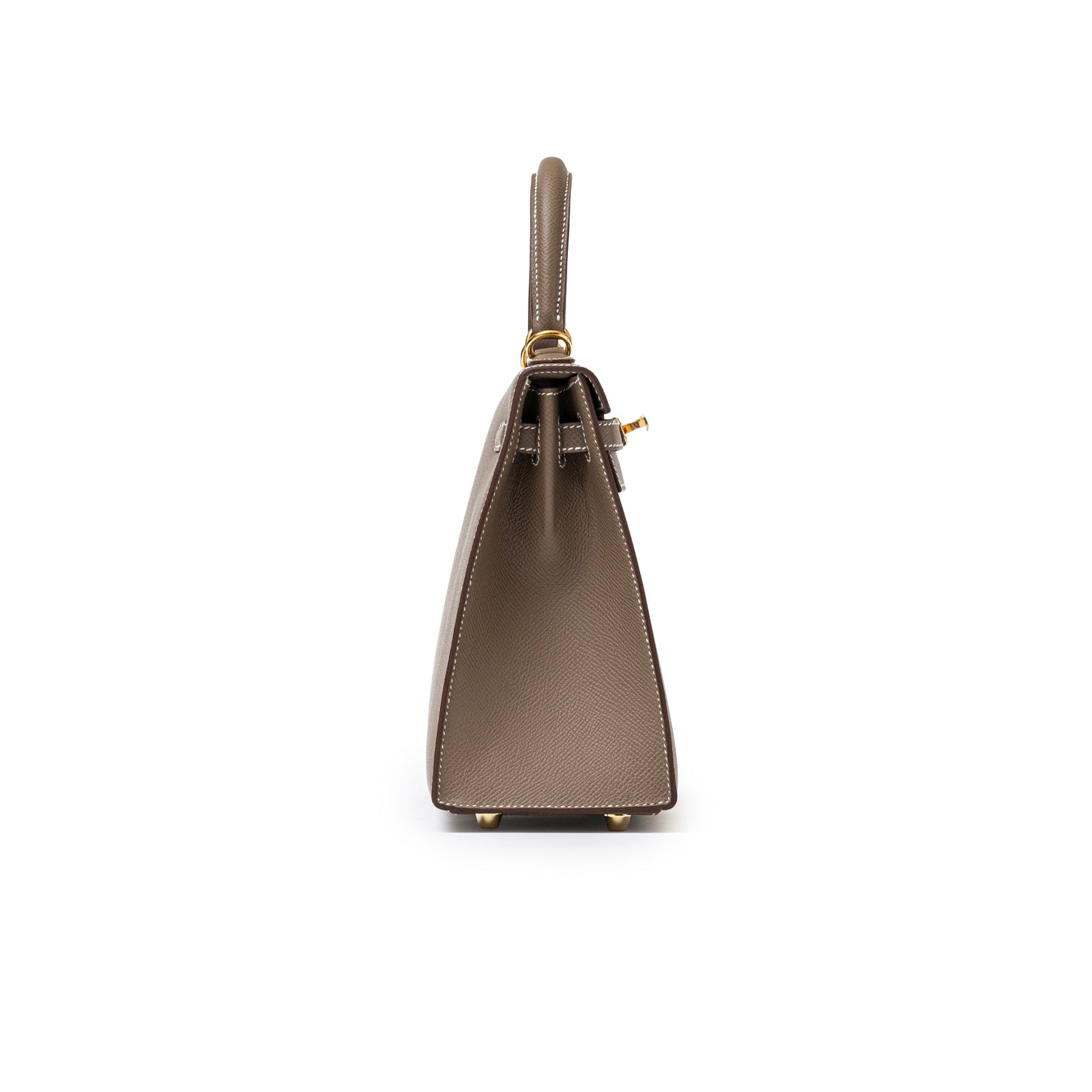 Side view of Hermès Kelly 25 Sellier Etoupe Epsom Gold Hardware showing structured silhouette and top handle