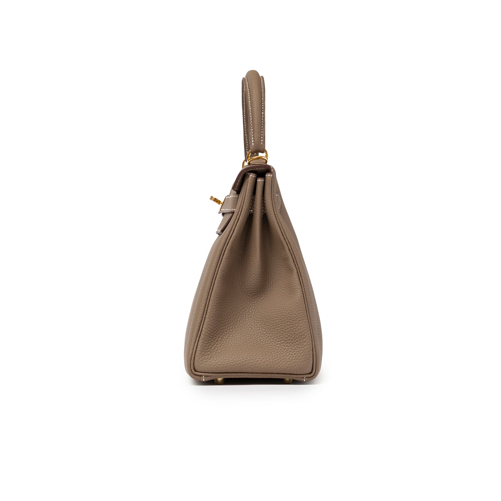Side profile of Hermès Kelly 28 Retourne Etoupe Togo Gold Hardware showing textured leather and handle detail