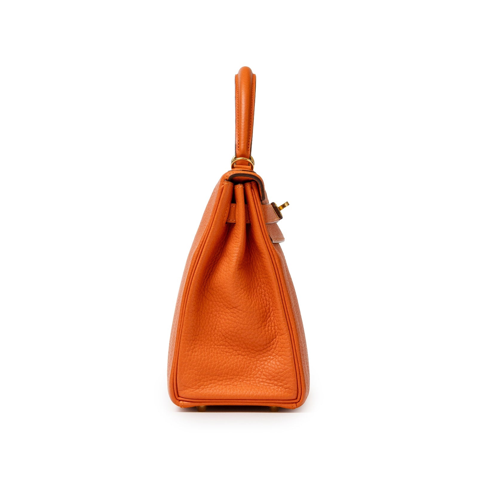 Side view of Hermès Kelly 28 Retourne Orange Clemence Gold Hardware showing textured leather and handle details