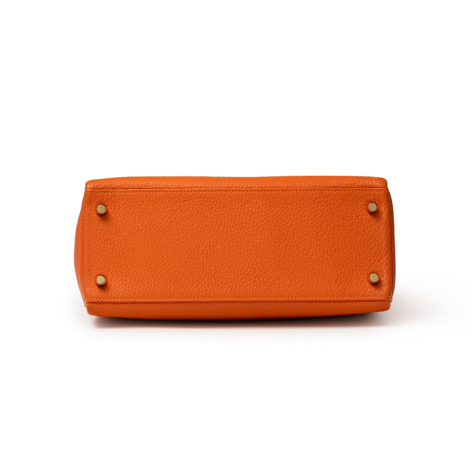 Bottom view of Hermès Kelly 28 Retourne Orange Clemence Gold Hardware showing leather texture and feet details