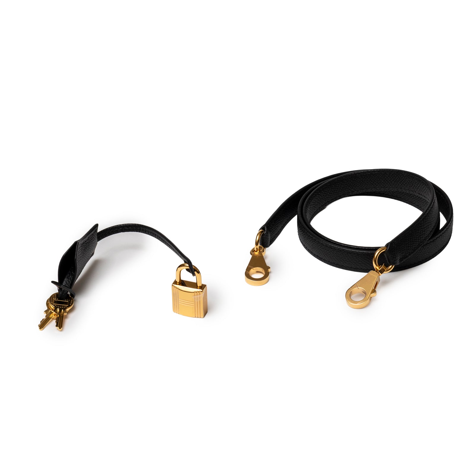 Black leather strap with gold lock and keys alongside matching black leather shoulder strap clips for Hermès Kelly 28 Sellier Black Epsom Gold Hardware