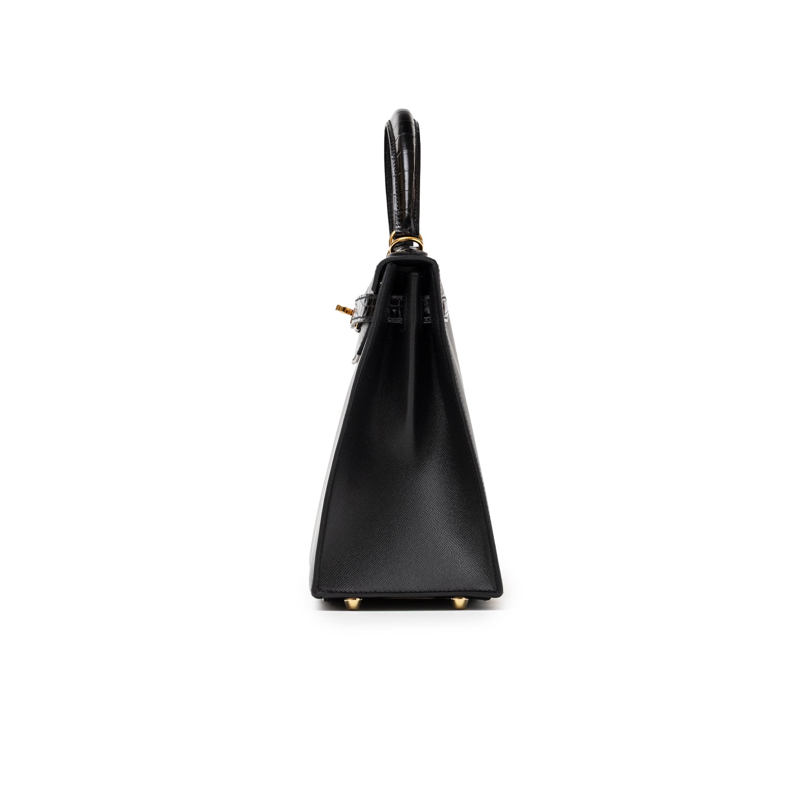Side profile of Hermès Kelly 28 Sellier Touch Black Madame Shiny Niloticus Crocodile Gold Hardware showing structured silhouette and handle