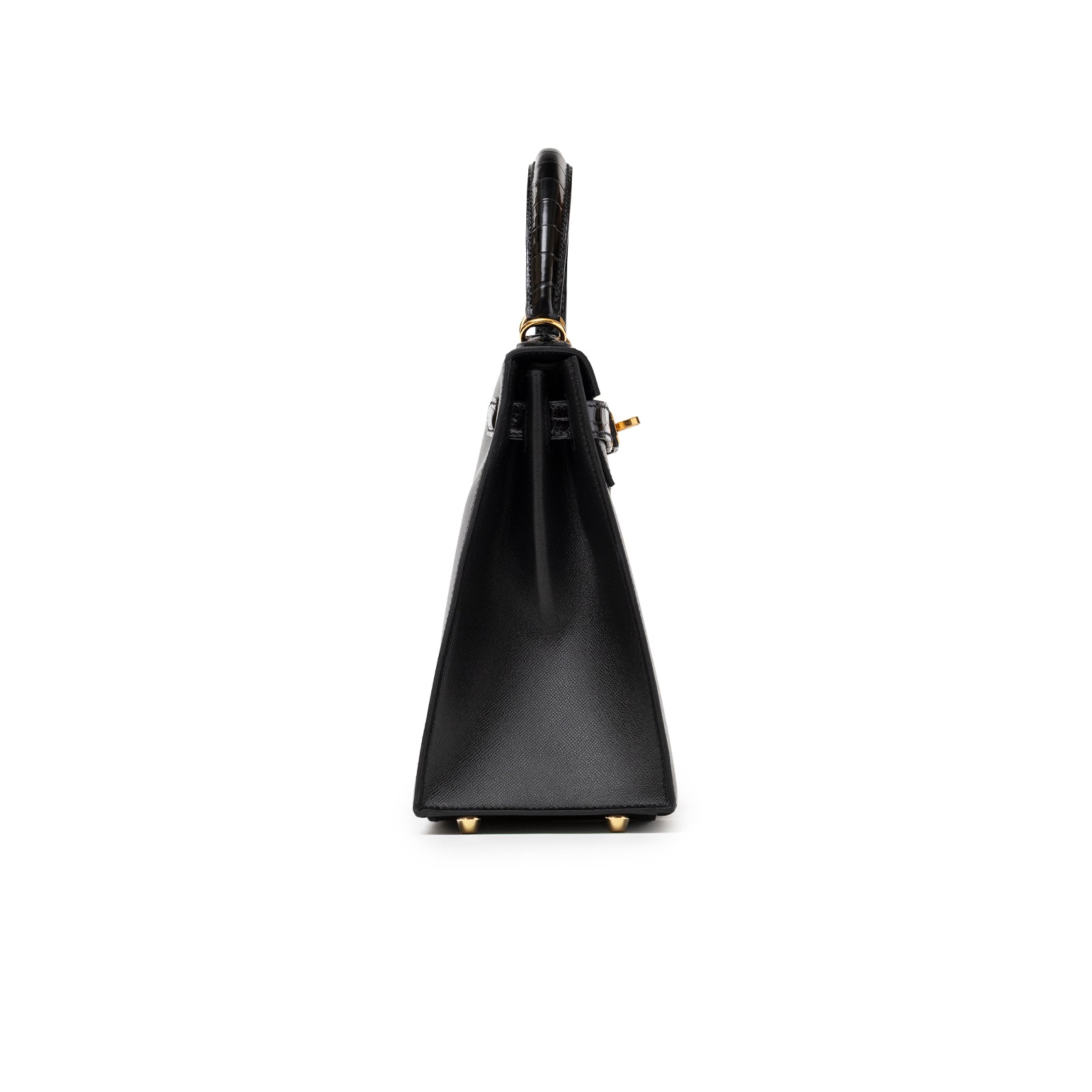 Profile view of Hermès Kelly 28 Sellier Touch Black Madame Shiny Niloticus Crocodile Gold Hardware handbag showing smooth side and handle