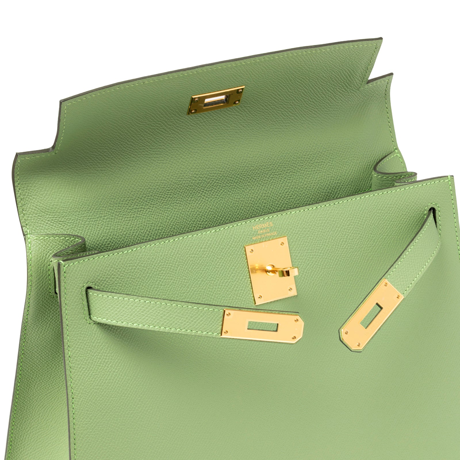Open top view of Hermès Kelly 28 Sellier Vert Criquet Epsom Gold Hardware showing interior flap and clasp detail